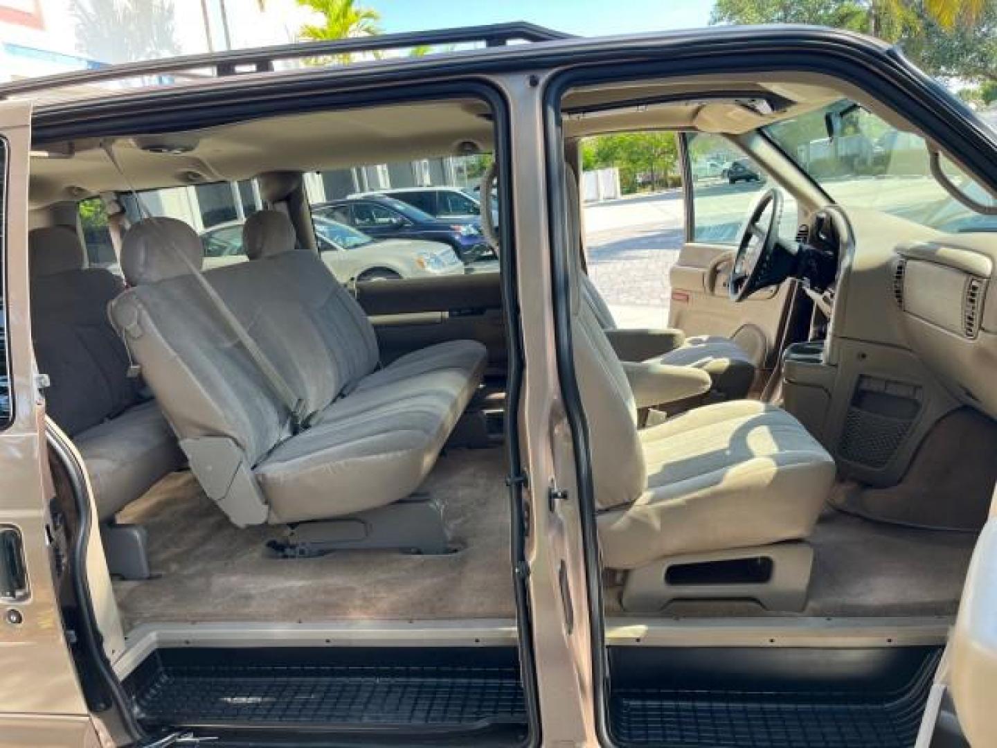 2003 Bronzemist Metallic /Medium Gray Chevrolet Astro Passenger 1 OWNER LOW MILES 79,048 (1GNDM19X83B) with an 4.3L Vortec 4300 V6 MFI Engine engine, Automatic transmission, located at 4701 North Dixie Hwy, Pompano Beach, FL, 33064, (954) 422-2889, 26.240938, -80.123474 - 2003 CHEVROLET ASTRO 8 PASSENGER SEATING ROAD READY 4.3L V6 VIN: 1GNDM19X83B119765 NO ACCIDENTS VAN NO RECALLS 4.3L V6 F OHV 12V 1 OWNER GASOLINE 3 ROW SEATS REAR WHEEL DRIVE LOW MILES 79,048 13 SERVICE RECORDS Approach Lights Cruise Control Front Bucket Seats Premium Sound Premium Sound System RWD - Photo#12