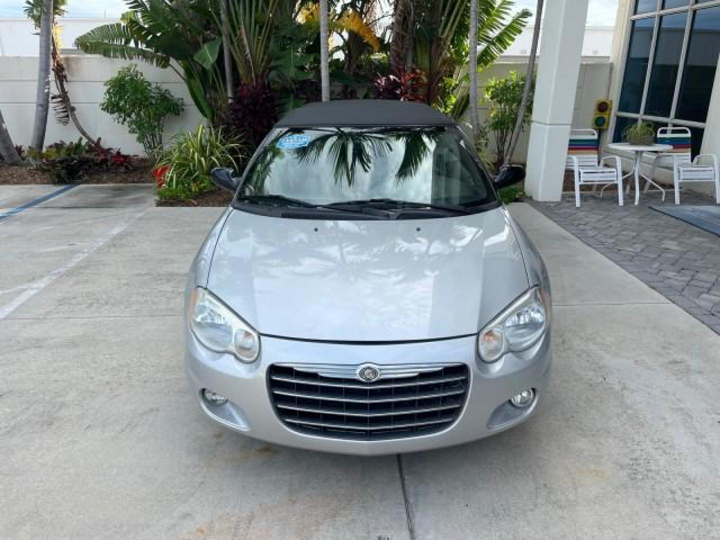 2005 Bright Silver Metallic /Dark Slate Gray Chrysler Sebring Conv Touring LOW MILES 73,711 (1C3EL55R35N) with an 2.7L DOHC SMPI 24-Valve V6 Engine engine, Automatic transmission, located at 4701 North Dixie Hwy, Pompano Beach, FL, 33064, (954) 422-2889, 26.240938, -80.123474 - OUR WEBPAGE FLORIDACARS1.COM HAS OVER 100 PHOTOS AND FREE CARFAX LINK 2005 CHRYSLER SEBRING TOURING ROAD READY 2.7L V6 VIN: 1C3EL55R35N595409 NO ACCIDENTS 28 MPG CONVERTIBLE NO RECALLS 2.7L V6 F DOHC 24V LOW MILES 73,711 GASOLINE POWER MIRRORS FLORIDA OWNER FRONT WHEEL DRIVE POWER SEATS POWER CONVER - Photo#2