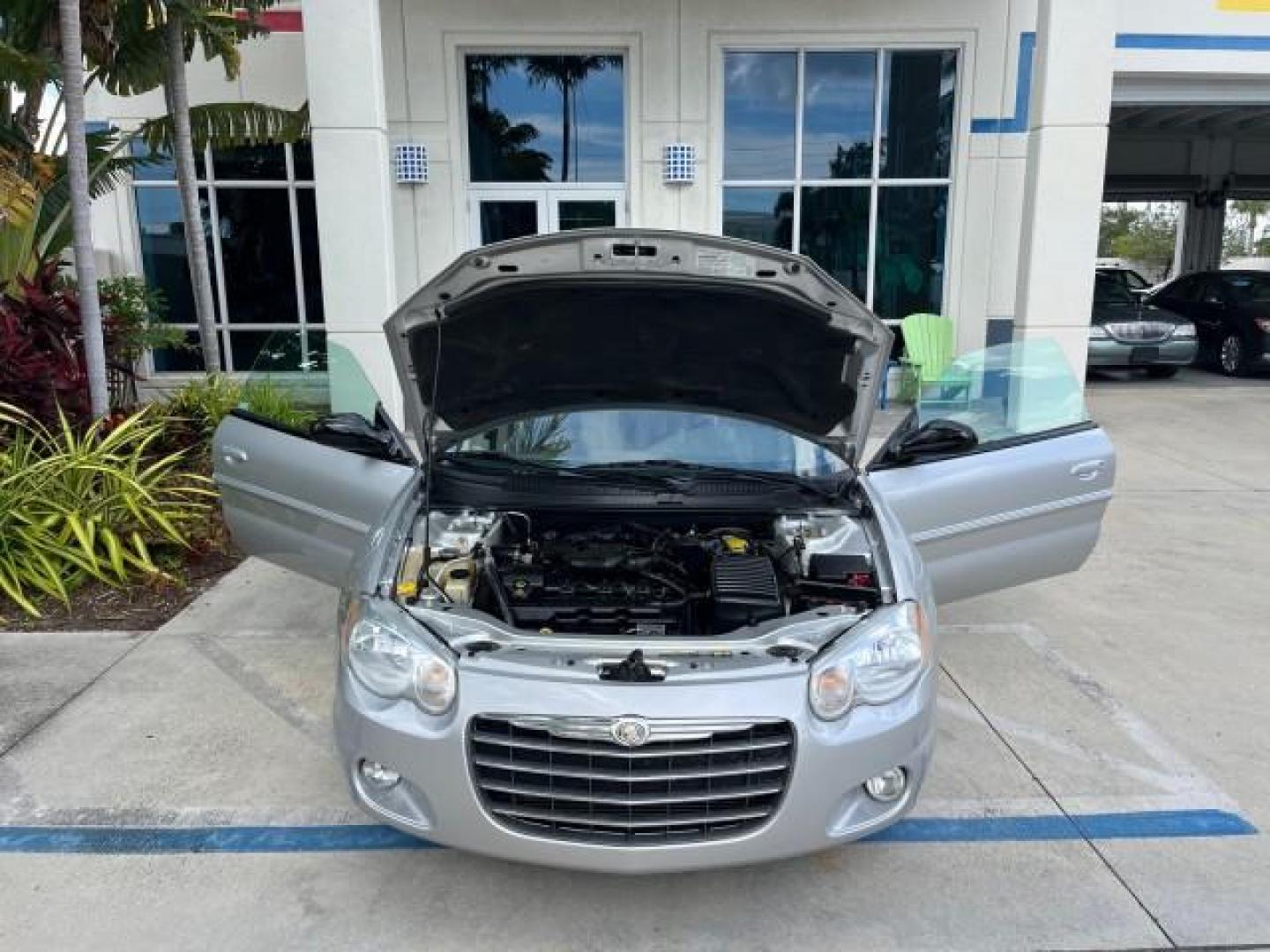 2005 Bright Silver Metallic /Dark Slate Gray Chrysler Sebring Conv Touring LOW MILES 73,711 (1C3EL55R35N) with an 2.7L DOHC SMPI 24-Valve V6 Engine engine, Automatic transmission, located at 4701 North Dixie Hwy, Pompano Beach, FL, 33064, (954) 422-2889, 26.240938, -80.123474 - OUR WEBPAGE FLORIDACARS1.COM HAS OVER 100 PHOTOS AND FREE CARFAX LINK 2005 CHRYSLER SEBRING TOURING ROAD READY 2.7L V6 VIN: 1C3EL55R35N595409 NO ACCIDENTS 28 MPG CONVERTIBLE NO RECALLS 2.7L V6 F DOHC 24V LOW MILES 73,711 GASOLINE POWER MIRRORS FLORIDA OWNER FRONT WHEEL DRIVE POWER SEATS POWER CONVER - Photo#16