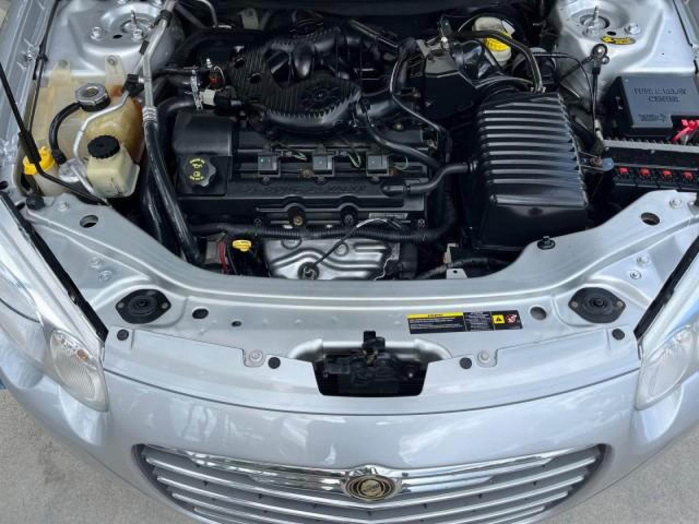 2005 Bright Silver Metallic /Dark Slate Gray Chrysler Sebring Conv Touring LOW MILES 73,711 (1C3EL55R35N) with an 2.7L DOHC SMPI 24-Valve V6 Engine engine, Automatic transmission, located at 4701 North Dixie Hwy, Pompano Beach, FL, 33064, (954) 422-2889, 26.240938, -80.123474 - OUR WEBPAGE FLORIDACARS1.COM HAS OVER 100 PHOTOS AND FREE CARFAX LINK 2005 CHRYSLER SEBRING TOURING ROAD READY 2.7L V6 VIN: 1C3EL55R35N595409 NO ACCIDENTS 28 MPG CONVERTIBLE NO RECALLS 2.7L V6 F DOHC 24V LOW MILES 73,711 GASOLINE POWER MIRRORS FLORIDA OWNER FRONT WHEEL DRIVE POWER SEATS POWER CONVER - Photo#17