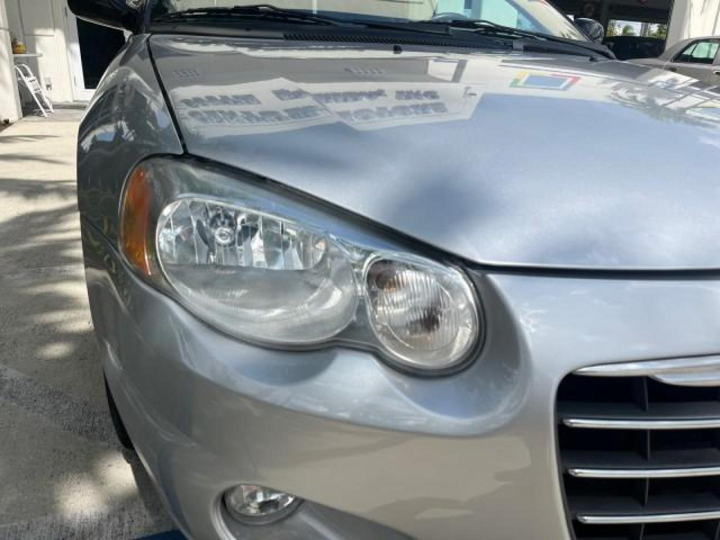 2005 Bright Silver Metallic /Dark Slate Gray Chrysler Sebring Conv Touring LOW MILES 73,711 (1C3EL55R35N) with an 2.7L DOHC SMPI 24-Valve V6 Engine engine, Automatic transmission, located at 4701 North Dixie Hwy, Pompano Beach, FL, 33064, (954) 422-2889, 26.240938, -80.123474 - OUR WEBPAGE FLORIDACARS1.COM HAS OVER 100 PHOTOS AND FREE CARFAX LINK 2005 CHRYSLER SEBRING TOURING ROAD READY 2.7L V6 VIN: 1C3EL55R35N595409 NO ACCIDENTS 28 MPG CONVERTIBLE NO RECALLS 2.7L V6 F DOHC 24V LOW MILES 73,711 GASOLINE POWER MIRRORS FLORIDA OWNER FRONT WHEEL DRIVE POWER SEATS POWER CONVER - Photo#66