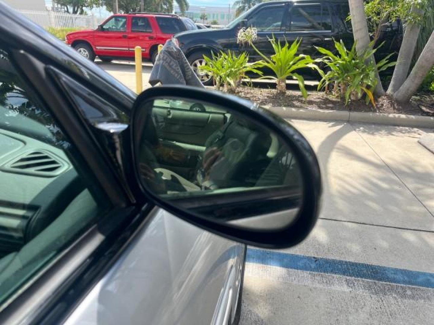 2005 Bright Silver Metallic /Dark Slate Gray Chrysler Sebring Conv Touring LOW MILES 73,711 (1C3EL55R35N) with an 2.7L DOHC SMPI 24-Valve V6 Engine engine, Automatic transmission, located at 4701 North Dixie Hwy, Pompano Beach, FL, 33064, (954) 422-2889, 26.240938, -80.123474 - OUR WEBPAGE FLORIDACARS1.COM HAS OVER 100 PHOTOS AND FREE CARFAX LINK 2005 CHRYSLER SEBRING TOURING ROAD READY 2.7L V6 VIN: 1C3EL55R35N595409 NO ACCIDENTS 28 MPG CONVERTIBLE NO RECALLS 2.7L V6 F DOHC 24V LOW MILES 73,711 GASOLINE POWER MIRRORS FLORIDA OWNER FRONT WHEEL DRIVE POWER SEATS POWER CONVER - Photo#77