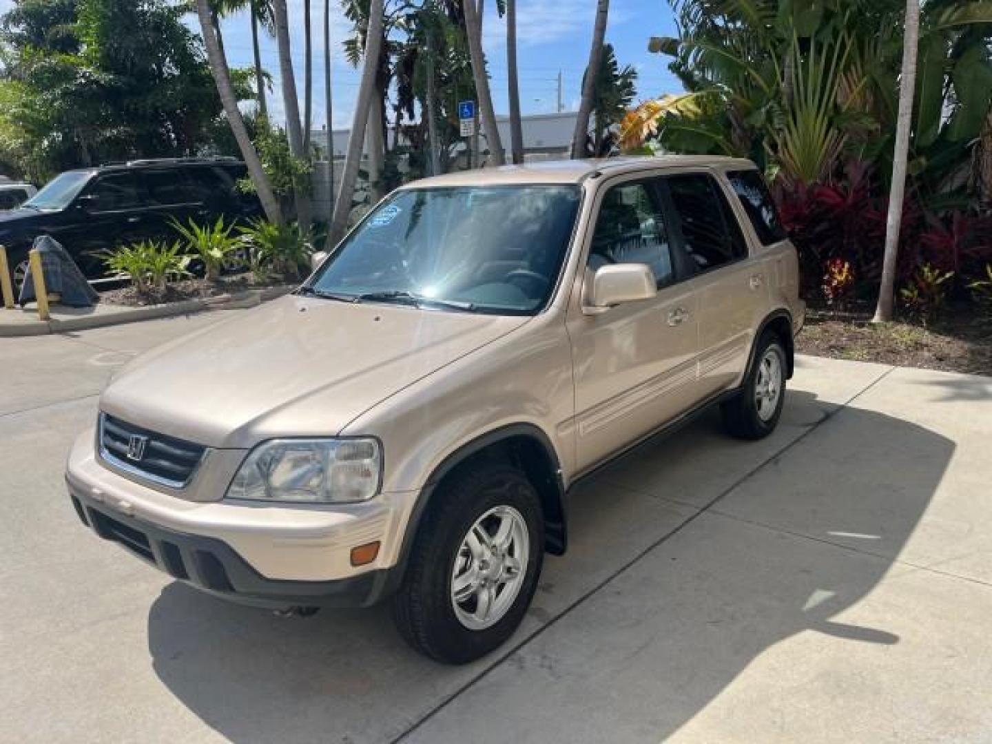 2001 Naples Gold Metallic /Gray Honda CR-V 4X4 SE LOW MILES 83,521 (JHLRD18741S) with an 2.0L DOHC MPFI 16-Valve I4 Engine engine, Automatic transmission, located at 4701 North Dixie Hwy, Pompano Beach, FL, 33064, (954) 422-2889, 26.240938, -80.123474 - OUR WEBPAGE FLORIDACARS1.COM HAS OVER 100 PHOTOS AND FREE CARFAX LINK 2001 HONDA CR-V SE ROAD READY 2.0L I4 VIN: JHLRD18741S003785 LOW MILES 83,521 4 DOOR WAGON/SPORT UTILITY ALL WHEEL DRIVE 4X4 2.0L I4 F SOHC 16V LEATHER SEATS GASOLINE 12 SERVICE RECORDS FRONT WHEEL DRIVE W/ 4X4 POWER MIRRORS AWD A - Photo#3