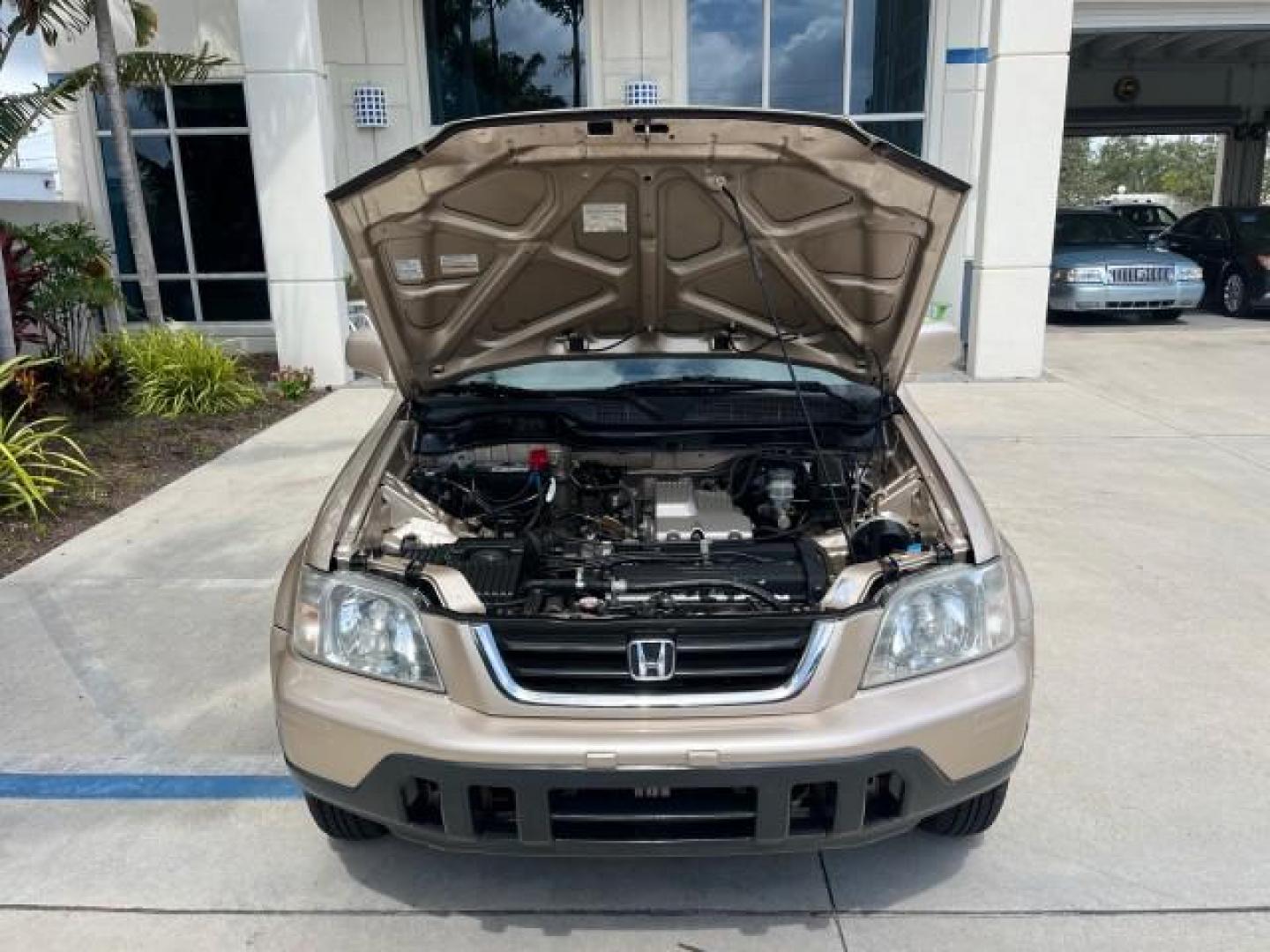 2001 Naples Gold Metallic /Gray Honda CR-V 4X4 SE LOW MILES 83,521 (JHLRD18741S) with an 2.0L DOHC MPFI 16-Valve I4 Engine engine, Automatic transmission, located at 4701 North Dixie Hwy, Pompano Beach, FL, 33064, (954) 422-2889, 26.240938, -80.123474 - OUR WEBPAGE FLORIDACARS1.COM HAS OVER 100 PHOTOS AND FREE CARFAX LINK 2001 HONDA CR-V SE ROAD READY 2.0L I4 VIN: JHLRD18741S003785 LOW MILES 83,521 4 DOOR WAGON/SPORT UTILITY ALL WHEEL DRIVE 4X4 2.0L I4 F SOHC 16V LEATHER SEATS GASOLINE 12 SERVICE RECORDS FRONT WHEEL DRIVE W/ 4X4 POWER MIRRORS AWD A - Photo#79