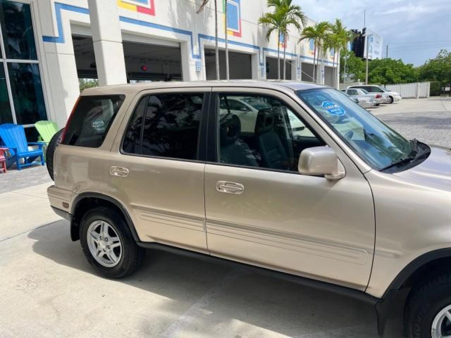 2001 Naples Gold Metallic /Gray Honda CR-V 4X4 SE LOW MILES 83,521 (JHLRD18741S) with an 2.0L DOHC MPFI 16-Valve I4 Engine engine, Automatic transmission, located at 4701 North Dixie Hwy, Pompano Beach, FL, 33064, (954) 422-2889, 26.240938, -80.123474 - OUR WEBPAGE FLORIDACARS1.COM HAS OVER 100 PHOTOS AND FREE CARFAX LINK 2001 HONDA CR-V SE ROAD READY 2.0L I4 VIN: JHLRD18741S003785 LOW MILES 83,521 4 DOOR WAGON/SPORT UTILITY ALL WHEEL DRIVE 4X4 2.0L I4 F SOHC 16V LEATHER SEATS GASOLINE 12 SERVICE RECORDS FRONT WHEEL DRIVE W/ 4X4 POWER MIRRORS AWD A - Photo#94