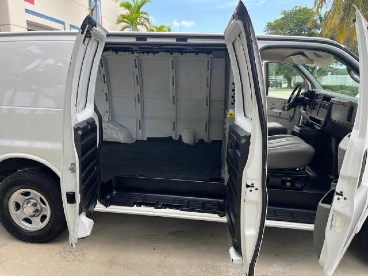 2006 Summit White /Medium Dark Pewter Chevrolet Express Cargo Van 1 FL LOW MILES 46,768 (1GCFG15X261) with an 4.3L Vortec 4300 V6 MFI Engine engine, Automatic transmission, located at 4701 North Dixie Hwy, Pompano Beach, FL, 33064, (954) 422-2889, 26.240938, -80.123474 - OUR WEBPAGE FLORIDACARS1.COM HAS OVER 100 PHOTOS AND FREE CARFAX LINK 2006 CHEVROLET EXPRESS 1500 ROAD READY WORK READY VIN: 1GCFG15X261224021 NO ACCIDENTS NO RECALLS VAN 1 OWNER FLORIDA 4.3L V6 F LOW MILES 46,768 4.3L V6 GASOLINE 10 SERVICE RECORDS REAR WHEEL DRIVE 9 FT CARGO SPACE Anti-Theft Syste - Photo#13