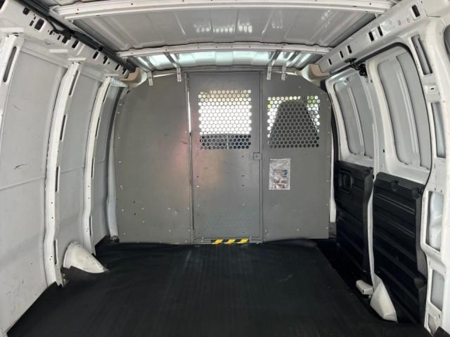 2006 Summit White /Medium Dark Pewter Chevrolet Express Cargo Van 1 FL LOW MILES 46,768 (1GCFG15X261) with an 4.3L Vortec 4300 V6 MFI Engine engine, Automatic transmission, located at 4701 North Dixie Hwy, Pompano Beach, FL, 33064, (954) 422-2889, 26.240938, -80.123474 - OUR WEBPAGE FLORIDACARS1.COM HAS OVER 100 PHOTOS AND FREE CARFAX LINK 2006 CHEVROLET EXPRESS 1500 ROAD READY WORK READY VIN: 1GCFG15X261224021 NO ACCIDENTS NO RECALLS VAN 1 OWNER FLORIDA 4.3L V6 F LOW MILES 46,768 4.3L V6 GASOLINE 10 SERVICE RECORDS REAR WHEEL DRIVE 9 FT CARGO SPACE Anti-Theft Syste - Photo#45