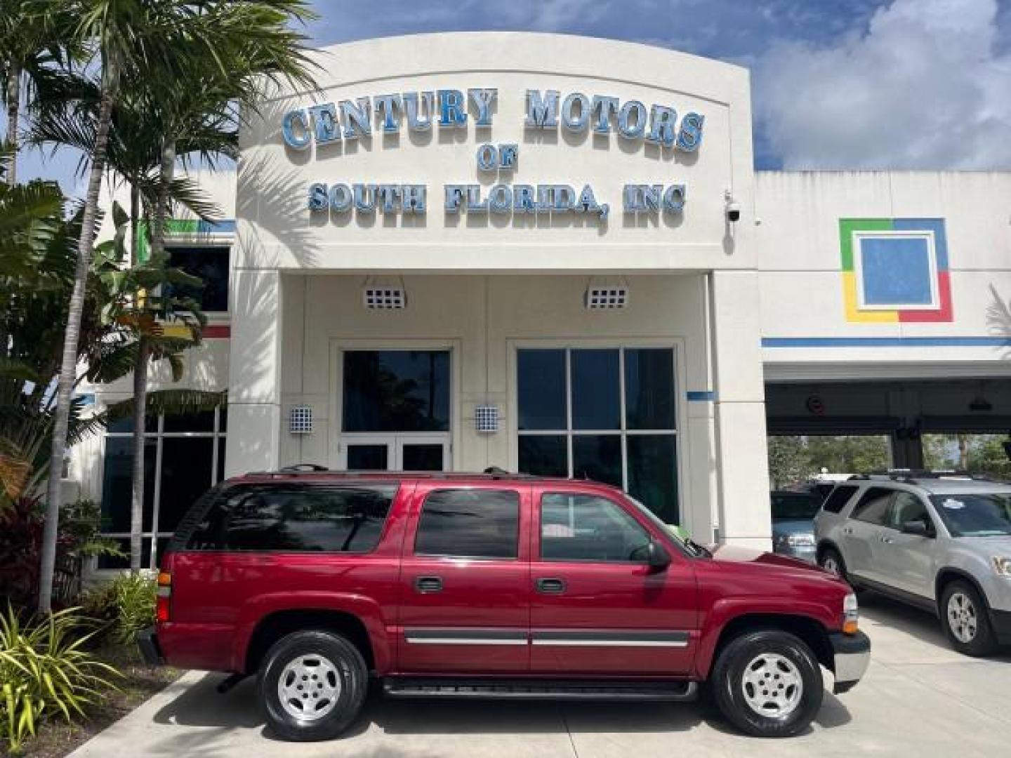 2005 Sport Red Metallic /Gray/Dark Charcoal Chevrolet Suburban LS 4X4 LOW MILES (3GNFK16Z55G) with an 5.3L Vortec 5300 V8 SFI Flex-Fuel Engine engine, Automatic transmission, located at 4701 North Dixie Hwy, Pompano Beach, FL, 33064, (954) 422-2889, 26.240938, -80.123474 - OUR WEBPAGE FLORIDACARS1.COM HAS OVER 100 PHOTOS AND FREE CARFAX LINK 2005 CHEVROLET SUBURBAN 1500 LS NEW $ 42,160 ROAD READY VIN: 3GNFK16Z55G214878 NO ACCIDENTS 5.3L V8 4 DOOR WAGON/SPORT UTILITY NO RECALLS 4X4 5.3L V8 F 3 ROW SEATS FLEX FUEL DUAL AC POWER SEATS/MIRRORS REAR WHEEL DRIVE W/ 4X4 LOW - Photo#0