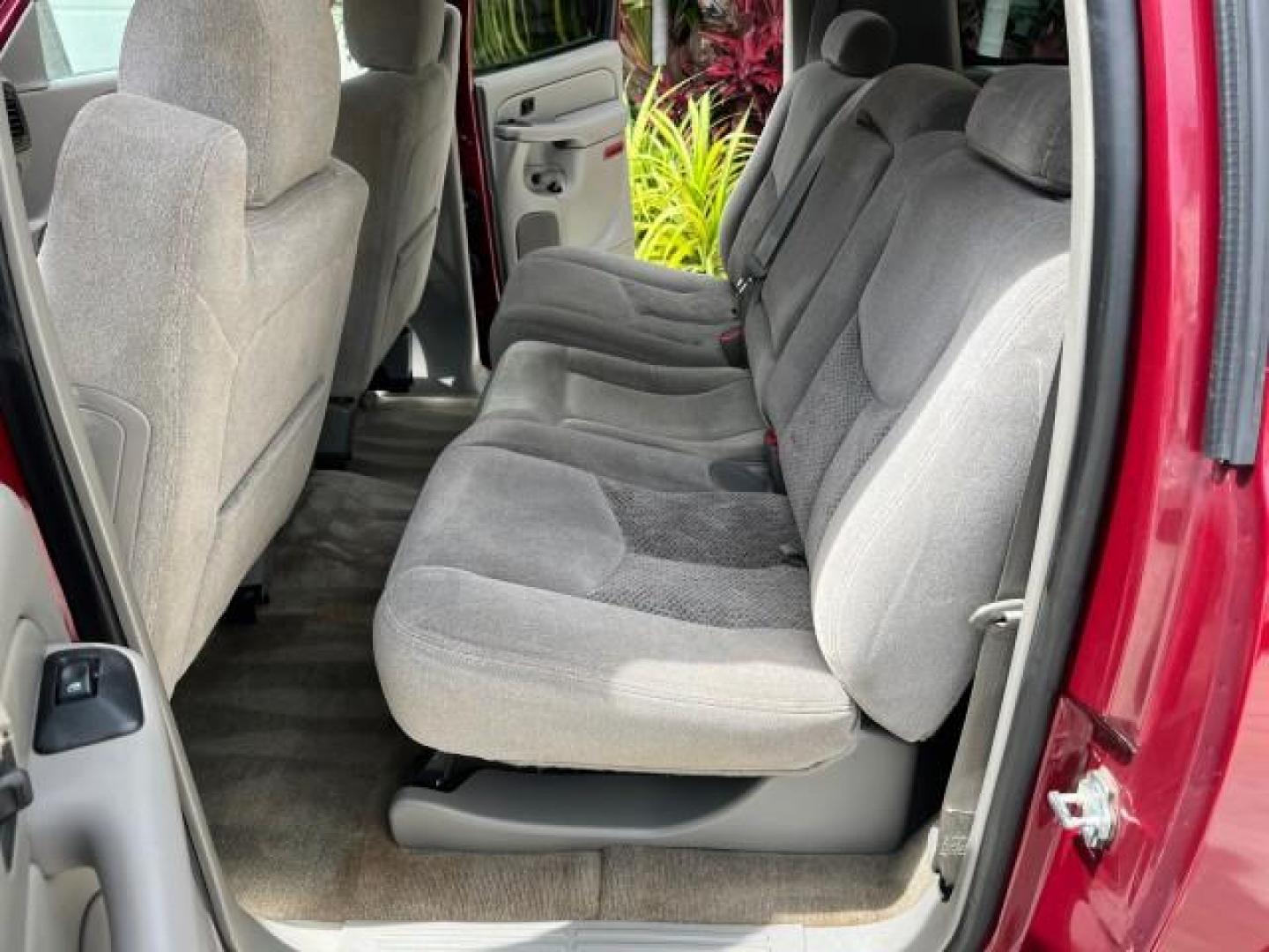 2005 Sport Red Metallic /Gray/Dark Charcoal Chevrolet Suburban LS 4X4 LOW MILES (3GNFK16Z55G) with an 5.3L Vortec 5300 V8 SFI Flex-Fuel Engine engine, Automatic transmission, located at 4701 North Dixie Hwy, Pompano Beach, FL, 33064, (954) 422-2889, 26.240938, -80.123474 - OUR WEBPAGE FLORIDACARS1.COM HAS OVER 100 PHOTOS AND FREE CARFAX LINK 2005 CHEVROLET SUBURBAN 1500 LS NEW $ 42,160 ROAD READY VIN: 3GNFK16Z55G214878 NO ACCIDENTS 5.3L V8 4 DOOR WAGON/SPORT UTILITY NO RECALLS 4X4 5.3L V8 F 3 ROW SEATS FLEX FUEL DUAL AC POWER SEATS/MIRRORS REAR WHEEL DRIVE W/ 4X4 LOW - Photo#14