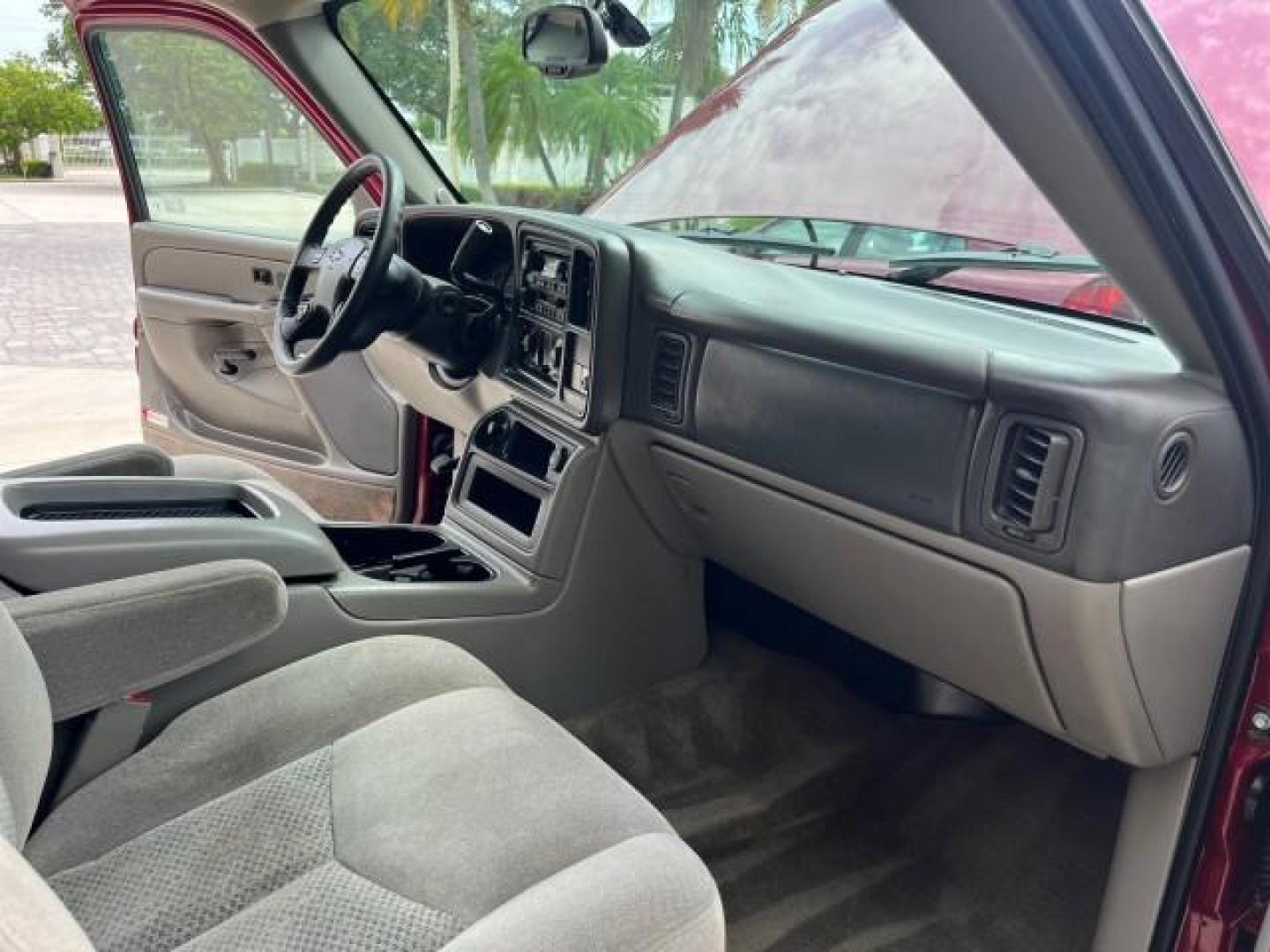 2005 Sport Red Metallic /Gray/Dark Charcoal Chevrolet Suburban LS 4X4 LOW MILES (3GNFK16Z55G) with an 5.3L Vortec 5300 V8 SFI Flex-Fuel Engine engine, Automatic transmission, located at 4701 North Dixie Hwy, Pompano Beach, FL, 33064, (954) 422-2889, 26.240938, -80.123474 - OUR WEBPAGE FLORIDACARS1.COM HAS OVER 100 PHOTOS AND FREE CARFAX LINK 2005 CHEVROLET SUBURBAN 1500 LS NEW $ 42,160 ROAD READY VIN: 3GNFK16Z55G214878 NO ACCIDENTS 5.3L V8 4 DOOR WAGON/SPORT UTILITY NO RECALLS 4X4 5.3L V8 F 3 ROW SEATS FLEX FUEL DUAL AC POWER SEATS/MIRRORS REAR WHEEL DRIVE W/ 4X4 LOW - Photo#27