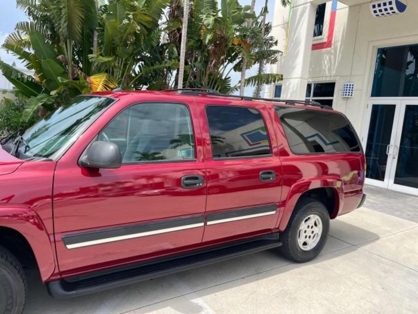 2005 Sport Red Metallic /Gray/Dark Charcoal Chevrolet Suburban LS 4X4 LOW MILES (3GNFK16Z55G) with an 5.3L Vortec 5300 V8 SFI Flex-Fuel Engine engine, Automatic transmission, located at 4701 North Dixie Hwy, Pompano Beach, FL, 33064, (954) 422-2889, 26.240938, -80.123474 - OUR WEBPAGE FLORIDACARS1.COM HAS OVER 100 PHOTOS AND FREE CARFAX LINK 2005 CHEVROLET SUBURBAN 1500 LS NEW $ 42,160 ROAD READY VIN: 3GNFK16Z55G214878 NO ACCIDENTS 5.3L V8 4 DOOR WAGON/SPORT UTILITY NO RECALLS 4X4 5.3L V8 F 3 ROW SEATS FLEX FUEL DUAL AC POWER SEATS/MIRRORS REAR WHEEL DRIVE W/ 4X4 LOW - Photo#83