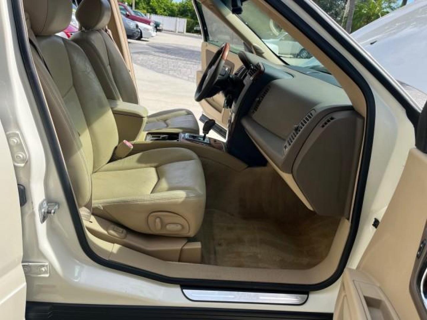 2006 White Diamond /Cashmere Cadillac SRX V 8 LOW MILES 63,331 (1GYEE63A560) with an 4.6L Northstar V8 VVT SFI Engine engine, Automatic transmission, located at 4701 North Dixie Hwy, Pompano Beach, FL, 33064, (954) 422-2889, 26.240938, -80.123474 - OUR WEBPAGE FLORIDACARS1.COM HAS OVER 100 PHOTOS AND FREE CARFAX LINK 2006 CADILLAC SRX NEW $ 48,695 ROAD READY VIN: 1GYEE63A560166824 NO RECALLS FLORIDA OWNER 4 DOOR WAGON/SPORT UTILITY LOW MILES 63,331 4.6L V8 4.6L V8 F POWER LIFTGATE POWER LEATHER SEATS/MIRRORS GASOLINE PARKING SENSORS PANORAMIC - Photo#12