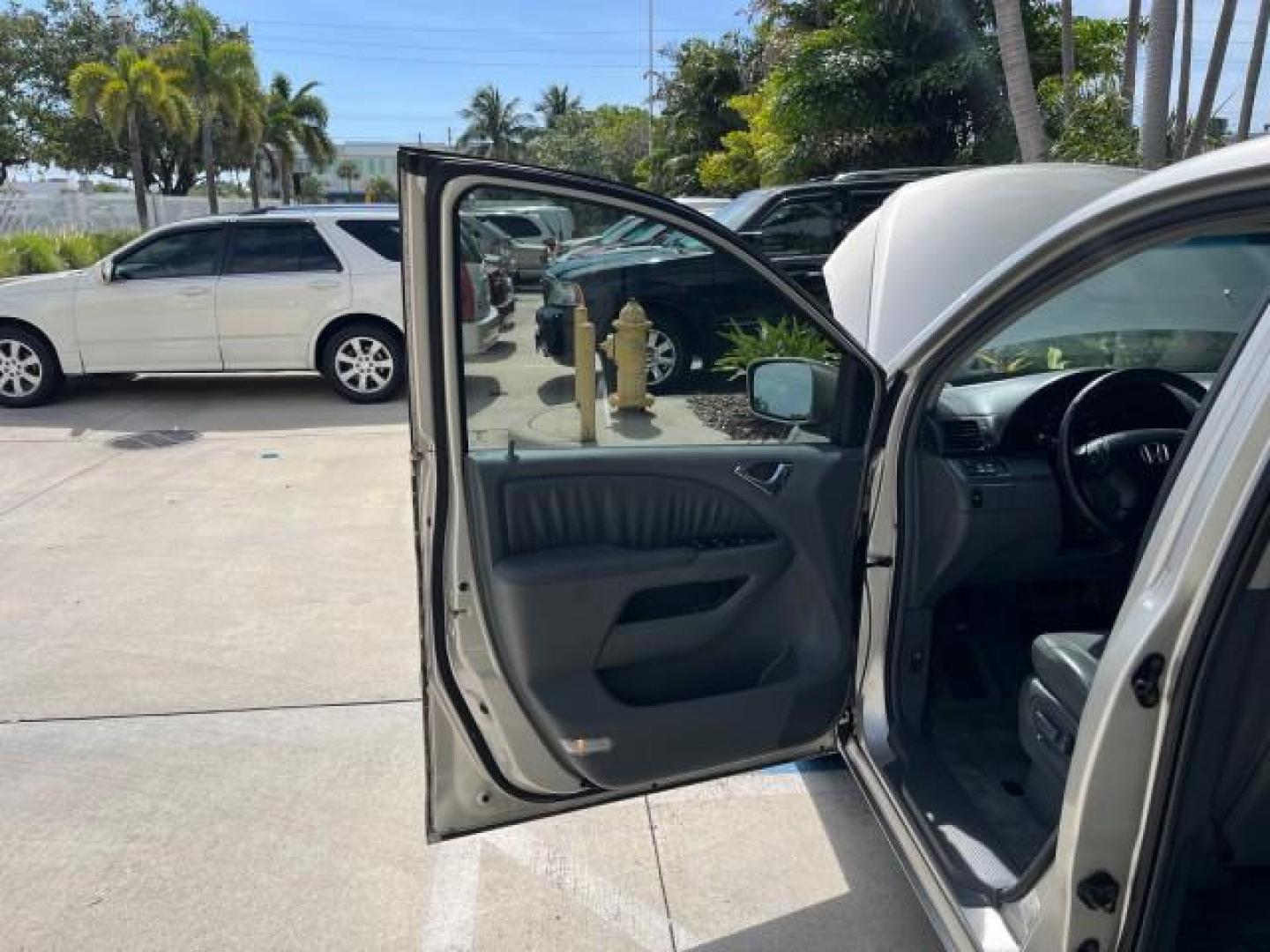 2006 Sage Brush Pearl /Gray Honda Odyssey EX-L LOW MILES 61,166 (5FNRL38696B) with an 3.5L SOHC MPFI 24-Valve i-VTEC V6 Engine engine, Automatic transmission, located at 4701 North Dixie Hwy, Pompano Beach, FL, 33064, (954) 422-2889, 26.240938, -80.123474 - OUR WEBPAGE FLORIDACARS1.COM HAS OVER 100 PHOTOS AND FREE CARFAX LINK 2006 HONDA ODYSSEY EX-L ROAD READY 3.5L V6 VIN: 5FNRL38696B408340 NO RECALLS 28 MPG VAN POWER SLIDING DOORS 3.5L V6 F SOHC 24V 3 ROW LEATHER SEATS GASOLINE LOW MILES 61,166 POWER SUNROOF/MIRRORS FRONT WHEEL DRIVE 1 OWNER 23 SERVIC - Photo#9