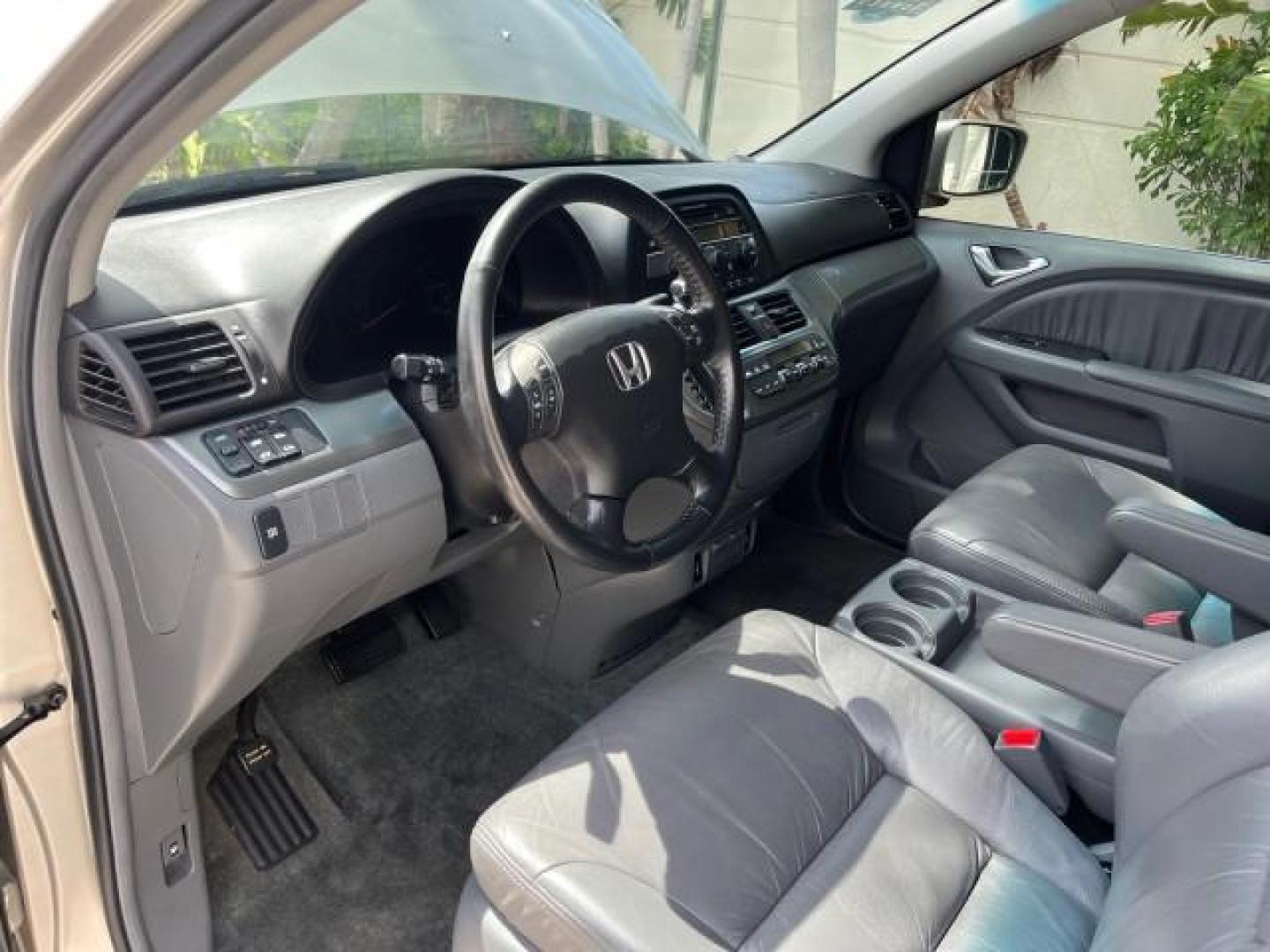 2006 Sage Brush Pearl /Gray Honda Odyssey EX-L LOW MILES 61,166 (5FNRL38696B) with an 3.5L SOHC MPFI 24-Valve i-VTEC V6 Engine engine, Automatic transmission, located at 4701 North Dixie Hwy, Pompano Beach, FL, 33064, (954) 422-2889, 26.240938, -80.123474 - OUR WEBPAGE FLORIDACARS1.COM HAS OVER 100 PHOTOS AND FREE CARFAX LINK 2006 HONDA ODYSSEY EX-L ROAD READY 3.5L V6 VIN: 5FNRL38696B408340 NO RECALLS 28 MPG VAN POWER SLIDING DOORS 3.5L V6 F SOHC 24V 3 ROW LEATHER SEATS GASOLINE LOW MILES 61,166 POWER SUNROOF/MIRRORS FRONT WHEEL DRIVE 1 OWNER 23 SERVIC - Photo#43