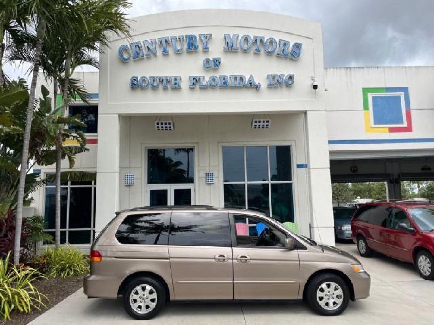 2003 Sandstone Metallic /Ivory Honda Odyssey 1 FL EX LOW MILES 65,633 (5FNRL18683B) with an 3.5L SOHC MPFI 24-Valve VTEC V6 Engine engine, Automatic transmission, located at 4701 North Dixie Hwy, Pompano Beach, FL, 33064, (954) 422-2889, 26.240938, -80.123474 - OUR WEBPAGE FLORIDACARS1.COM HAS OVER 100 PHOTOS AND FREE CARFAX LINK 2003 HONDA ODYSSEY EX ROAD READY 3.5L V6 VIN: 5FNRL18683B006146 NO ACCIDENTS VAN NO RECALLS 3.5L V6 F SOHC 16 SERVICE RECORDS LOW MILES 65,633 GASOLINE POWER SEATS/MIRRORS POWER SLIDING DOORS FRONT WHEEL DRIVE 3 ROW SEATS 1 OWNER - Photo#0