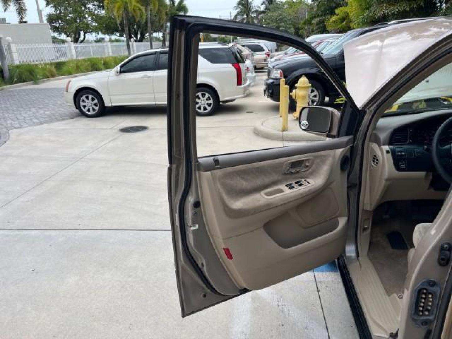 2003 Sandstone Metallic /Ivory Honda Odyssey 1 FL EX LOW MILES 65,633 (5FNRL18683B) with an 3.5L SOHC MPFI 24-Valve VTEC V6 Engine engine, Automatic transmission, located at 4701 North Dixie Hwy, Pompano Beach, FL, 33064, (954) 422-2889, 26.240938, -80.123474 - OUR WEBPAGE FLORIDACARS1.COM HAS OVER 100 PHOTOS AND FREE CARFAX LINK 2003 HONDA ODYSSEY EX ROAD READY 3.5L V6 VIN: 5FNRL18683B006146 NO ACCIDENTS VAN NO RECALLS 3.5L V6 F SOHC 16 SERVICE RECORDS LOW MILES 65,633 GASOLINE POWER SEATS/MIRRORS POWER SLIDING DOORS FRONT WHEEL DRIVE 3 ROW SEATS 1 OWNER - Photo#9