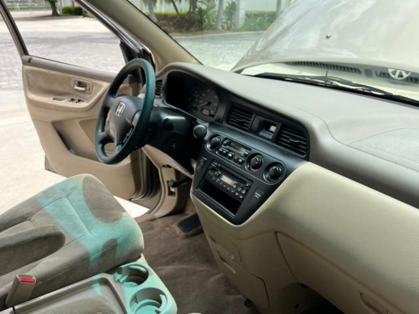 2003 Sandstone Metallic /Ivory Honda Odyssey 1 FL EX LOW MILES 65,633 (5FNRL18683B) with an 3.5L SOHC MPFI 24-Valve VTEC V6 Engine engine, Automatic transmission, located at 4701 North Dixie Hwy, Pompano Beach, FL, 33064, (954) 422-2889, 26.240938, -80.123474 - OUR WEBPAGE FLORIDACARS1.COM HAS OVER 100 PHOTOS AND FREE CARFAX LINK 2003 HONDA ODYSSEY EX ROAD READY 3.5L V6 VIN: 5FNRL18683B006146 NO ACCIDENTS VAN NO RECALLS 3.5L V6 F SOHC 16 SERVICE RECORDS LOW MILES 65,633 GASOLINE POWER SEATS/MIRRORS POWER SLIDING DOORS FRONT WHEEL DRIVE 3 ROW SEATS 1 OWNER - Photo#29