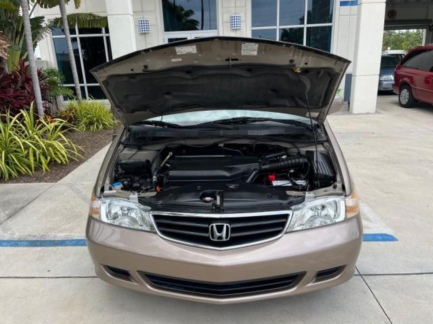 2003 Sandstone Metallic /Ivory Honda Odyssey 1 FL EX LOW MILES 65,633 (5FNRL18683B) with an 3.5L SOHC MPFI 24-Valve VTEC V6 Engine engine, Automatic transmission, located at 4701 North Dixie Hwy, Pompano Beach, FL, 33064, (954) 422-2889, 26.240938, -80.123474 - OUR WEBPAGE FLORIDACARS1.COM HAS OVER 100 PHOTOS AND FREE CARFAX LINK 2003 HONDA ODYSSEY EX ROAD READY 3.5L V6 VIN: 5FNRL18683B006146 NO ACCIDENTS VAN NO RECALLS 3.5L V6 F SOHC 16 SERVICE RECORDS LOW MILES 65,633 GASOLINE POWER SEATS/MIRRORS POWER SLIDING DOORS FRONT WHEEL DRIVE 3 ROW SEATS 1 OWNER - Photo#76