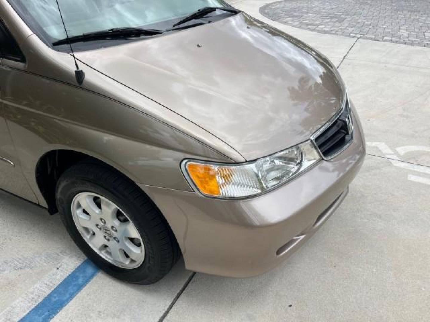 2003 Sandstone Metallic /Ivory Honda Odyssey 1 FL EX LOW MILES 65,633 (5FNRL18683B) with an 3.5L SOHC MPFI 24-Valve VTEC V6 Engine engine, Automatic transmission, located at 4701 North Dixie Hwy, Pompano Beach, FL, 33064, (954) 422-2889, 26.240938, -80.123474 - OUR WEBPAGE FLORIDACARS1.COM HAS OVER 100 PHOTOS AND FREE CARFAX LINK 2003 HONDA ODYSSEY EX ROAD READY 3.5L V6 VIN: 5FNRL18683B006146 NO ACCIDENTS VAN NO RECALLS 3.5L V6 F SOHC 16 SERVICE RECORDS LOW MILES 65,633 GASOLINE POWER SEATS/MIRRORS POWER SLIDING DOORS FRONT WHEEL DRIVE 3 ROW SEATS 1 OWNER - Photo#92