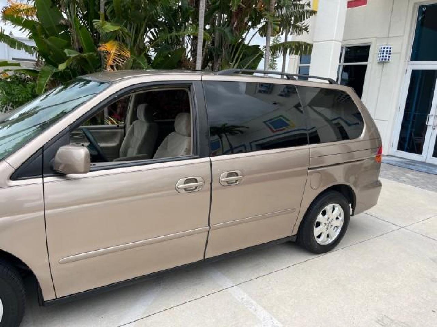 2003 Sandstone Metallic /Ivory Honda Odyssey 1 FL EX LOW MILES 65,633 (5FNRL18683B) with an 3.5L SOHC MPFI 24-Valve VTEC V6 Engine engine, Automatic transmission, located at 4701 North Dixie Hwy, Pompano Beach, FL, 33064, (954) 422-2889, 26.240938, -80.123474 - OUR WEBPAGE FLORIDACARS1.COM HAS OVER 100 PHOTOS AND FREE CARFAX LINK 2003 HONDA ODYSSEY EX ROAD READY 3.5L V6 VIN: 5FNRL18683B006146 NO ACCIDENTS VAN NO RECALLS 3.5L V6 F SOHC 16 SERVICE RECORDS LOW MILES 65,633 GASOLINE POWER SEATS/MIRRORS POWER SLIDING DOORS FRONT WHEEL DRIVE 3 ROW SEATS 1 OWNER - Photo#95