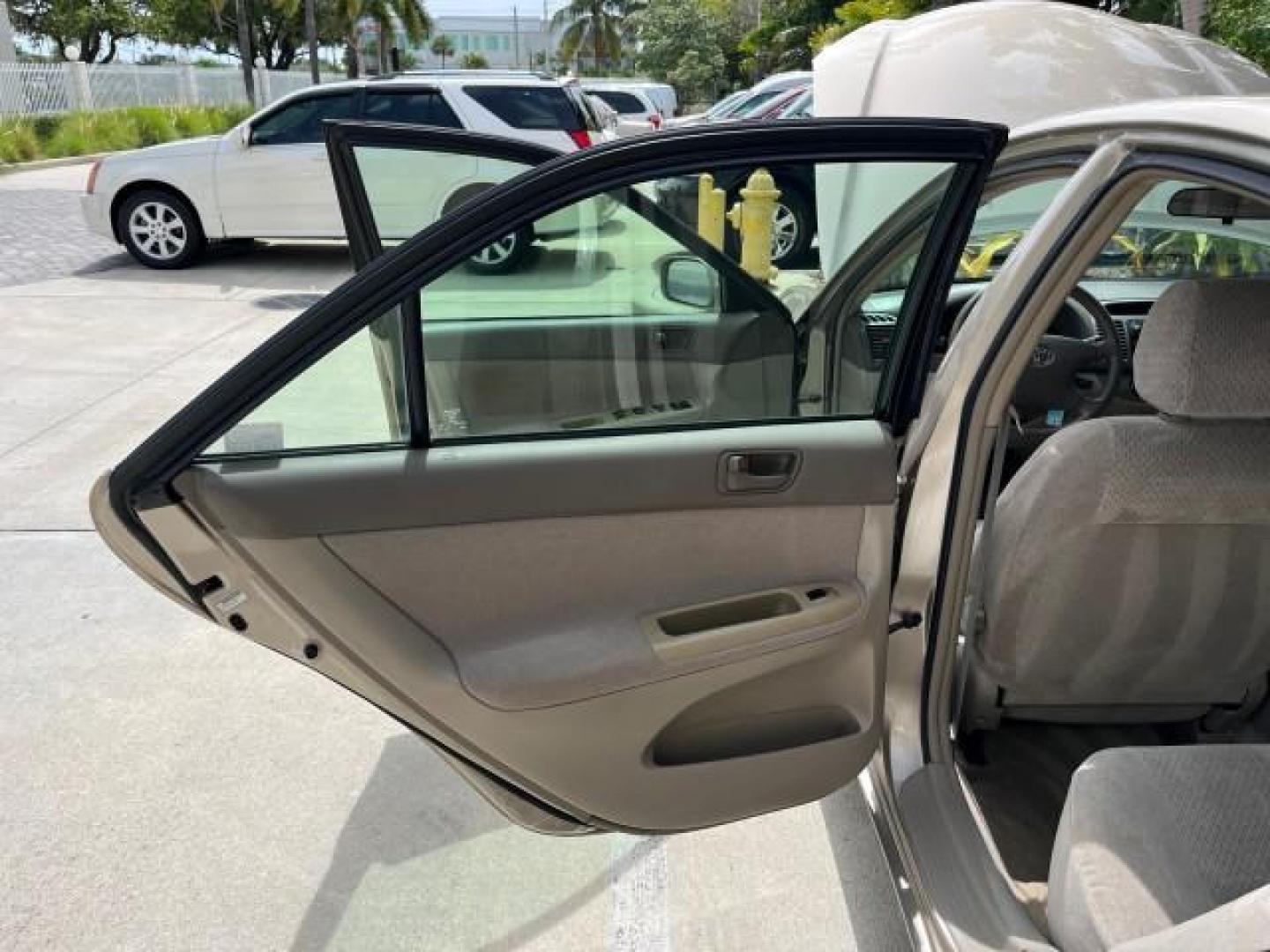 2003 Desert Sand Mica /Stone Toyota Camry 1 OWNER LE LOW MILES 57,114 (4T1BE32K73U) with an 2.4L DOHC Vvti 16-Valve 4-Cyl Engine engine, Automatic transmission, located at 4701 North Dixie Hwy, Pompano Beach, FL, 33064, (954) 422-2889, 26.240938, -80.123474 - OUR WEBPAGE FLORIDACARS1.COM HAS OVER 100 PHOTOS AND FREE CARFAX LINK 2003 TOYOTA CAMRY LE ROAD READY 2.4L I4 VIN: 4T1BE32K73U646722 NO RECALLS 32 MPG SEDAN 4 DR 1 OWNER 2.4L I4 F DOHC 16V LOW MILES 57,114 GASOLINE 7 SERVICE RECORDS FRONT WHEEL DRIVE POWER MIRRORS Approach Lights Cruise Control FWD - Photo#13