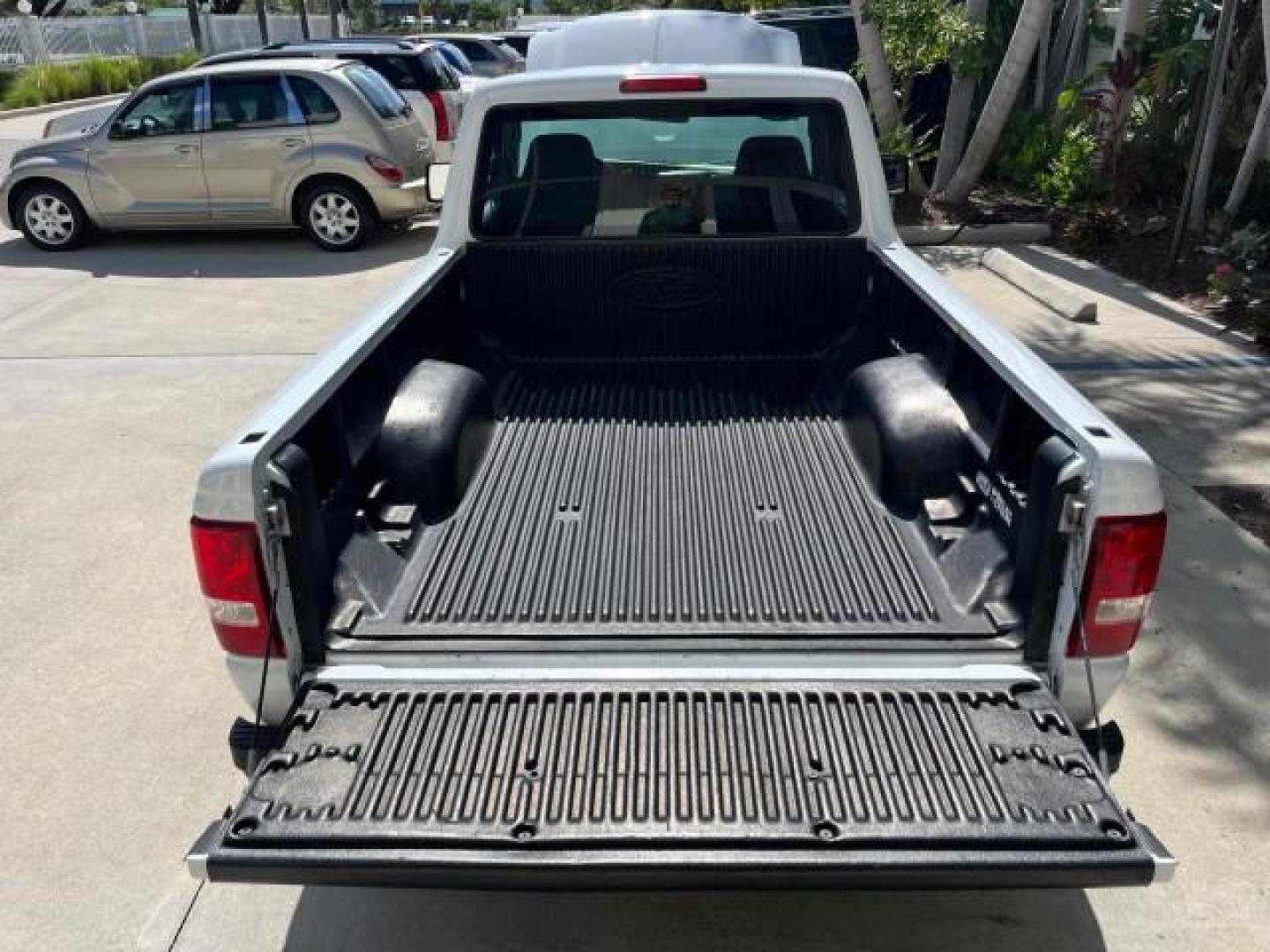 2006 Oxford White /Medium Dk Flint Ford Ranger XL LOW MILES 88,391 (1FTYR10D66P) with an 2.3L DOHC 16-Valve I4 Engine engine, Automatic transmission, located at 4701 North Dixie Hwy, Pompano Beach, FL, 33064, (954) 422-2889, 26.240938, -80.123474 - OUR WEBPAGE FLORIDACARS1.COM HAS OVER 100 PHOTOS AND FREE CARFAX LINK 2006 FORD RANGER XL ROAD READY WORK READY VIN: 1FTYR10D66PA49267 2.3L I 4 29 MPG PICKUP 13 SERVICE RECORDS 2.3L 4 F NO ACCIDENTS GASOLINE LOW MILES 88,391 REAR WHEEL DRIVE 6 FT BED LENGHT Connected Car Electronic Braking System Ma - Photo#45