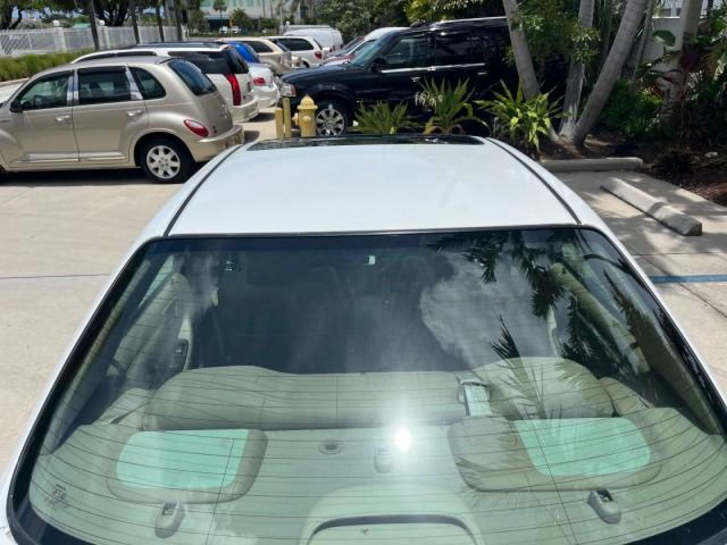 2000 Taffeta White /Quartz Honda Accord Sdn EX w/Leather LOW MILES 56,836 (1HGCG1650YA) with an 3.0L VTEC LEV-Certified V6 Engine engine, Automatic transmission, located at 4701 North Dixie Hwy, Pompano Beach, FL, 33064, (954) 422-2889, 26.240938, -80.123474 - OUR WEBPAGE FLORIDACARS1.COM HAS OVER 100 PHOTOS AND FREE CARFAX LINK 2000 HONDA ACCORD EX V6 ROAD READY 3.0L V6 VIN: 1HGCG1650YA037493 FLORIDA OWNER 28 MPG SEDAN 4 DR POWER LEATHER SEATS 3.0L V6 F SOHC 24V POWER SUNROOF/MIRRORS GASOLINE LOW MILES 56,836 FRONT WHEEL DRIVE 22 SERVICE RECORDS Alloy Wh - Photo#90