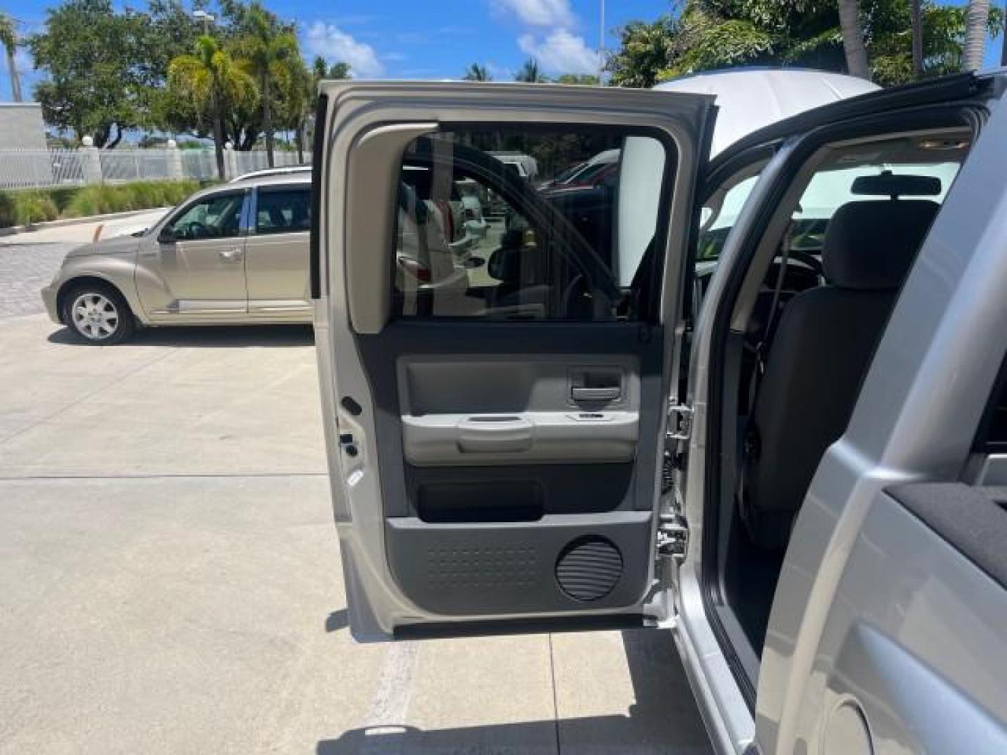 2006 Bright Silver Metallic /Med Slate Gray Dodge Dakota SLT 4 DR CREW LOW MILES 66,598 (1D7HE48NX6S) with an 4.7L V8 Magnum Engine engine, Automatic transmission, located at 4701 North Dixie Hwy, Pompano Beach, FL, 33064, (954) 422-2889, 26.240938, -80.123474 - OUR WEBPAGE FLORIDACARS1.COM HAS OVER 100 PHOTOS AND FREE CARFAX LINK 2006 DODGE DAKOTA SLT ROAD READY 4.7L V8 VIN: 1D7HE48NX6S517370 NO ACCIDENTS CREW PICKUP NO RECALLS 4.7L V8 F OHV 1 OWNER 5,4 FT BED GASOLINE LOW MILES 66,598 REAR WHEEL DRIVE 24 SERVICE RECORDS 5.4' Bed Length Anti-Theft System C - Photo#13