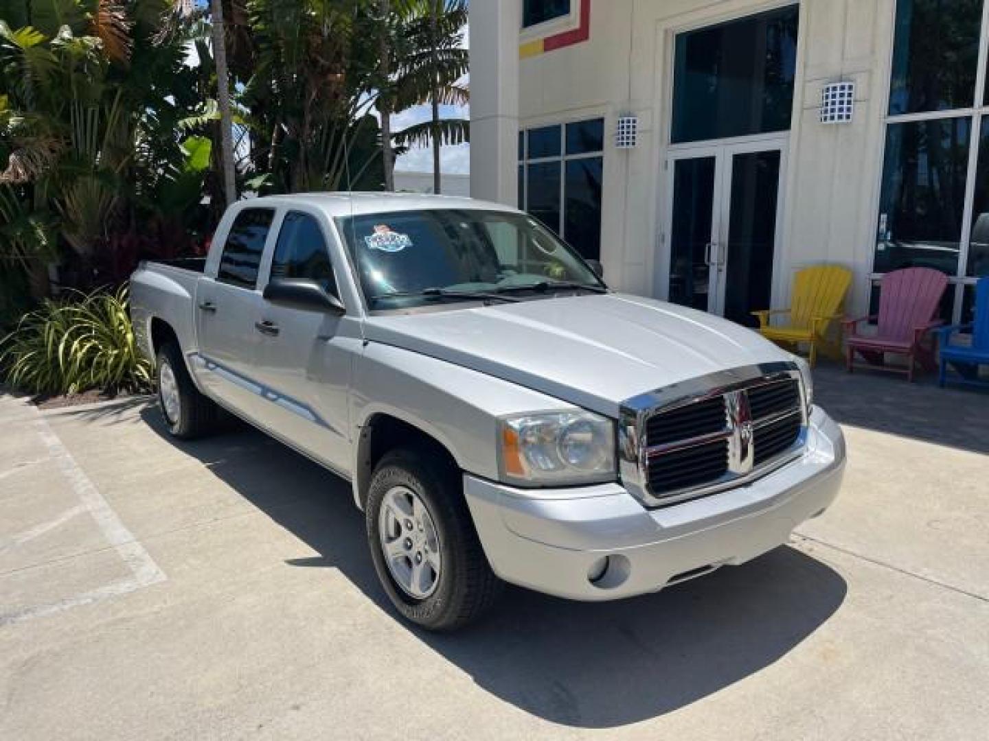 2006 Bright Silver Metallic /Med Slate Gray Dodge Dakota SLT 4 DR CREW LOW MILES 66,598 (1D7HE48NX6S) with an 4.7L V8 Magnum Engine engine, Automatic transmission, located at 4701 North Dixie Hwy, Pompano Beach, FL, 33064, (954) 422-2889, 26.240938, -80.123474 - OUR WEBPAGE FLORIDACARS1.COM HAS OVER 100 PHOTOS AND FREE CARFAX LINK 2006 DODGE DAKOTA SLT ROAD READY 4.7L V8 VIN: 1D7HE48NX6S517370 NO ACCIDENTS CREW PICKUP NO RECALLS 4.7L V8 F OHV 1 OWNER 5,4 FT BED GASOLINE LOW MILES 66,598 REAR WHEEL DRIVE 24 SERVICE RECORDS 5.4' Bed Length Anti-Theft System C - Photo#1