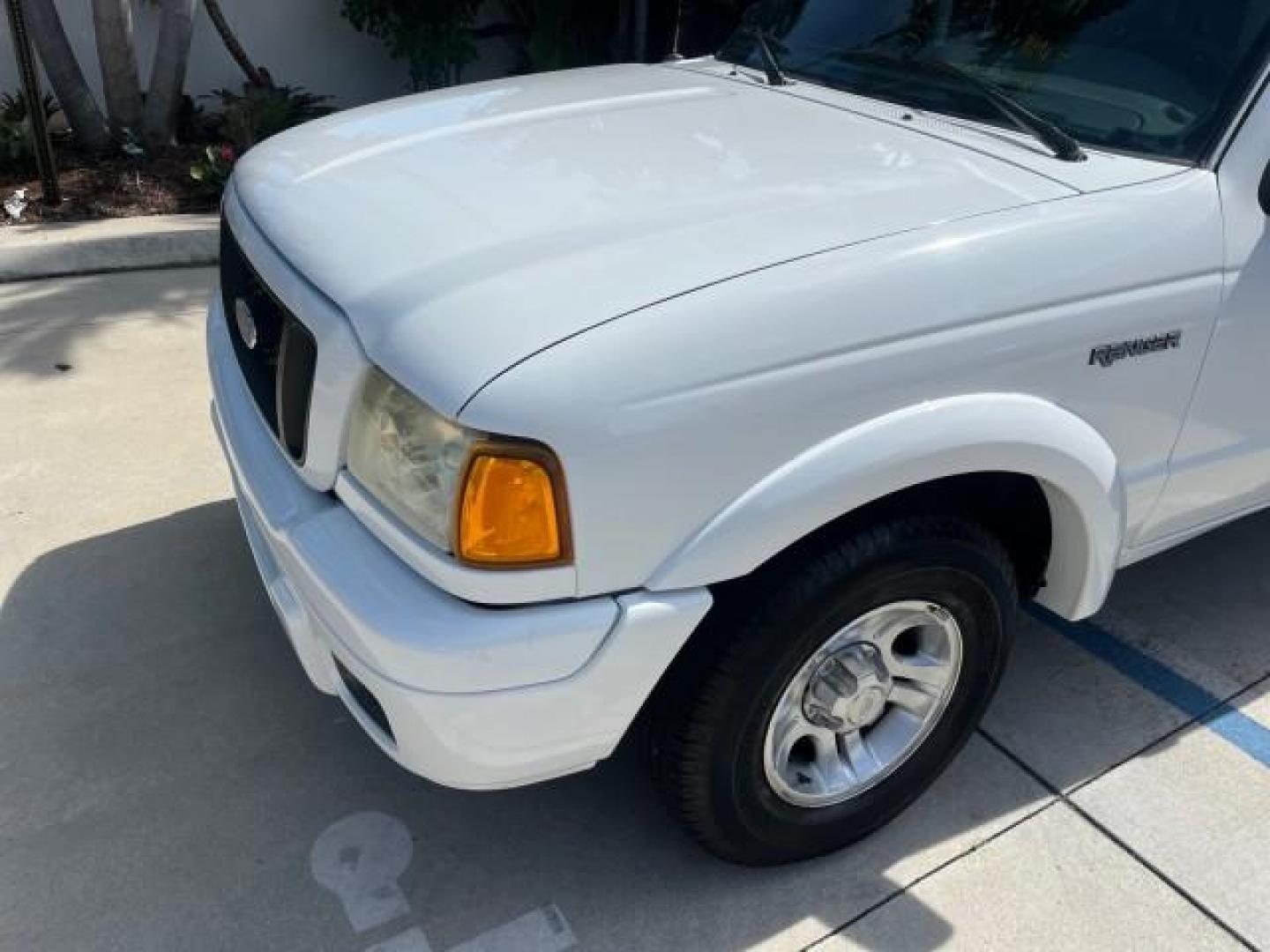 2004 Oxford White /Medium Dk Flint Ford Ranger Edge LOW MILES 89,753 (1FTYR10U14T) with an 3.0L SEFI V6 Engine engine, Automatic transmission, located at 4701 North Dixie Hwy, Pompano Beach, FL, 33064, (954) 422-2889, 26.240938, -80.123474 - OUR WEBPAGE FLORIDACARS1.COM HAS OVER 100 PHOTOS AND FREE CARFAX LINK 2004 FORD RANGER XLT ROAD READY 3.OL V6 VIN: 1FTYR10U14TA20148 NO ACCIDENTS PICKUP LOW MILES 89,753 3.0L V6 F OHV FLORIDA OWNER GASOLINE 4 SERVICE RECORDS REAR WHEEL DRIVE 6 FT BED Alloy Wheels Anti-Theft System Approach Lights Au - Photo#55