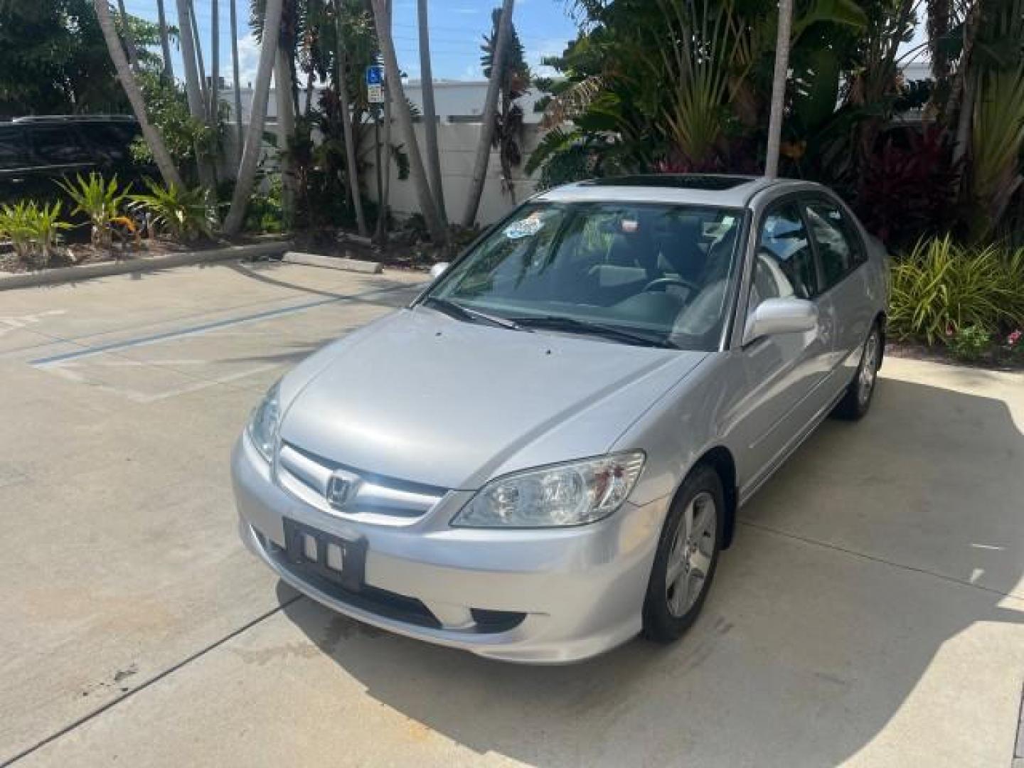 2004 Satin Silver Metallic /Gray Honda Civic EX LOW MILES 32,118 (2HGES26834H) with an 1.7L SOHC MPFI 16-Valve VTEC I4 Engine engine, Automatic transmission, located at 4701 North Dixie Hwy, Pompano Beach, FL, 33064, (954) 422-2889, 26.240938, -80.123474 - 2004 HONDA CIVIC EX ROAD READY 1.7L I4 VIN: 2HGES26834H541264 NO RECALLS 38 MPG SEDAN 4 DR 1 OWNER LOW MILES 31,118 1.7L I4 F SOHC POWER SUNROOF GASOLINE POWER MIRRORS FRONT WHEEL DRIVE 18 SERVICE RECORDS Alloy Wheels Approach Lights Cruise Control FWD Front Bucket Seats Moonroof / Sunroof THIS IS O - Photo#3