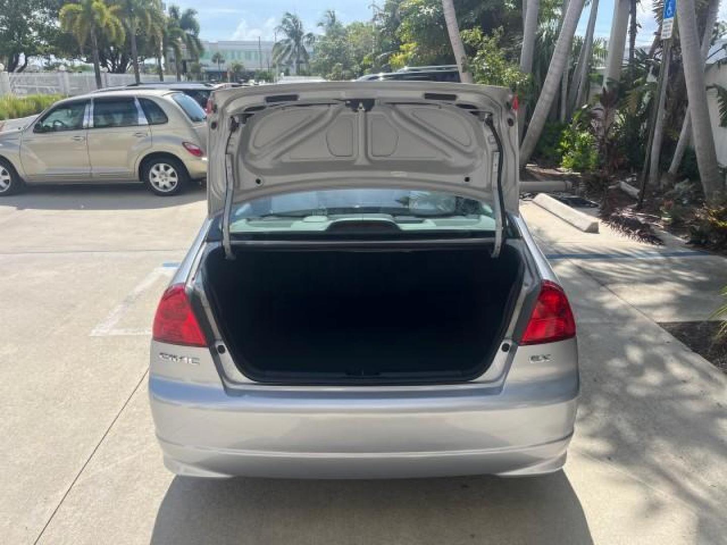 2004 Satin Silver Metallic /Gray Honda Civic EX LOW MILES 32,118 (2HGES26834H) with an 1.7L SOHC MPFI 16-Valve VTEC I4 Engine engine, Automatic transmission, located at 4701 North Dixie Hwy, Pompano Beach, FL, 33064, (954) 422-2889, 26.240938, -80.123474 - 2004 HONDA CIVIC EX ROAD READY 1.7L I4 VIN: 2HGES26834H541264 NO RECALLS 38 MPG SEDAN 4 DR 1 OWNER LOW MILES 31,118 1.7L I4 F SOHC POWER SUNROOF GASOLINE POWER MIRRORS FRONT WHEEL DRIVE 18 SERVICE RECORDS Alloy Wheels Approach Lights Cruise Control FWD Front Bucket Seats Moonroof / Sunroof THIS IS O - Photo#60