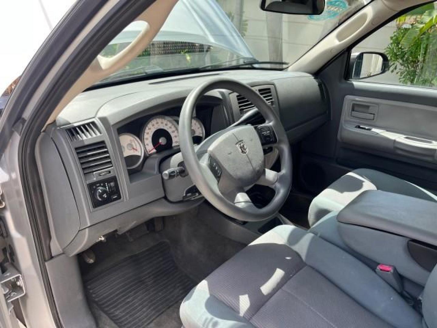 2005 Bright Silver Metallic /Med Slate Gray Dodge Dakota X CAB SLT LOW MILES 65,989 (1D7HE42KX5S) with an 3.7L V6 Magnum Engine engine, Automatic transmission, located at 4701 North Dixie Hwy, Pompano Beach, FL, 33064, (954) 422-2889, 26.240938, -80.123474 - OUR WEBPAGE FLORIDACARS1.COM HAS OVER 90 PHOTOS AND FREE CARFAX LINK 2005 DODGE DAKOTA SLT ROAD READY WORK READY VIN: 1D7HE42KX5S129990 FLORIDA OWNER 3.7L V6 CLUB CAB PICKUP LOW MILES 65,989 3.7L V6 F 6.6FT BED LENGHT GASOLINE POWER SEATS REAR WHEEL DRIVE POWER MIRRORS 6.6' Bed Length Alloy Wheels A - Photo#31