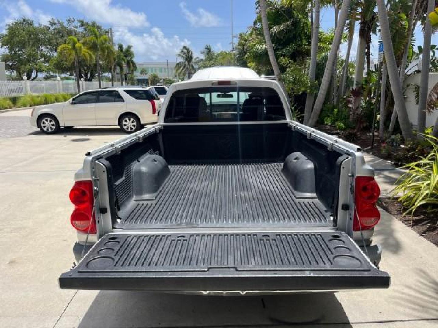 2005 Bright Silver Metallic /Med Slate Gray Dodge Dakota X CAB SLT LOW MILES 65,989 (1D7HE42KX5S) with an 3.7L V6 Magnum Engine engine, Automatic transmission, located at 4701 North Dixie Hwy, Pompano Beach, FL, 33064, (954) 422-2889, 26.240938, -80.123474 - OUR WEBPAGE FLORIDACARS1.COM HAS OVER 90 PHOTOS AND FREE CARFAX LINK 2005 DODGE DAKOTA SLT ROAD READY WORK READY VIN: 1D7HE42KX5S129990 FLORIDA OWNER 3.7L V6 CLUB CAB PICKUP LOW MILES 65,989 3.7L V6 F 6.6FT BED LENGHT GASOLINE POWER SEATS REAR WHEEL DRIVE POWER MIRRORS 6.6' Bed Length Alloy Wheels A - Photo#51