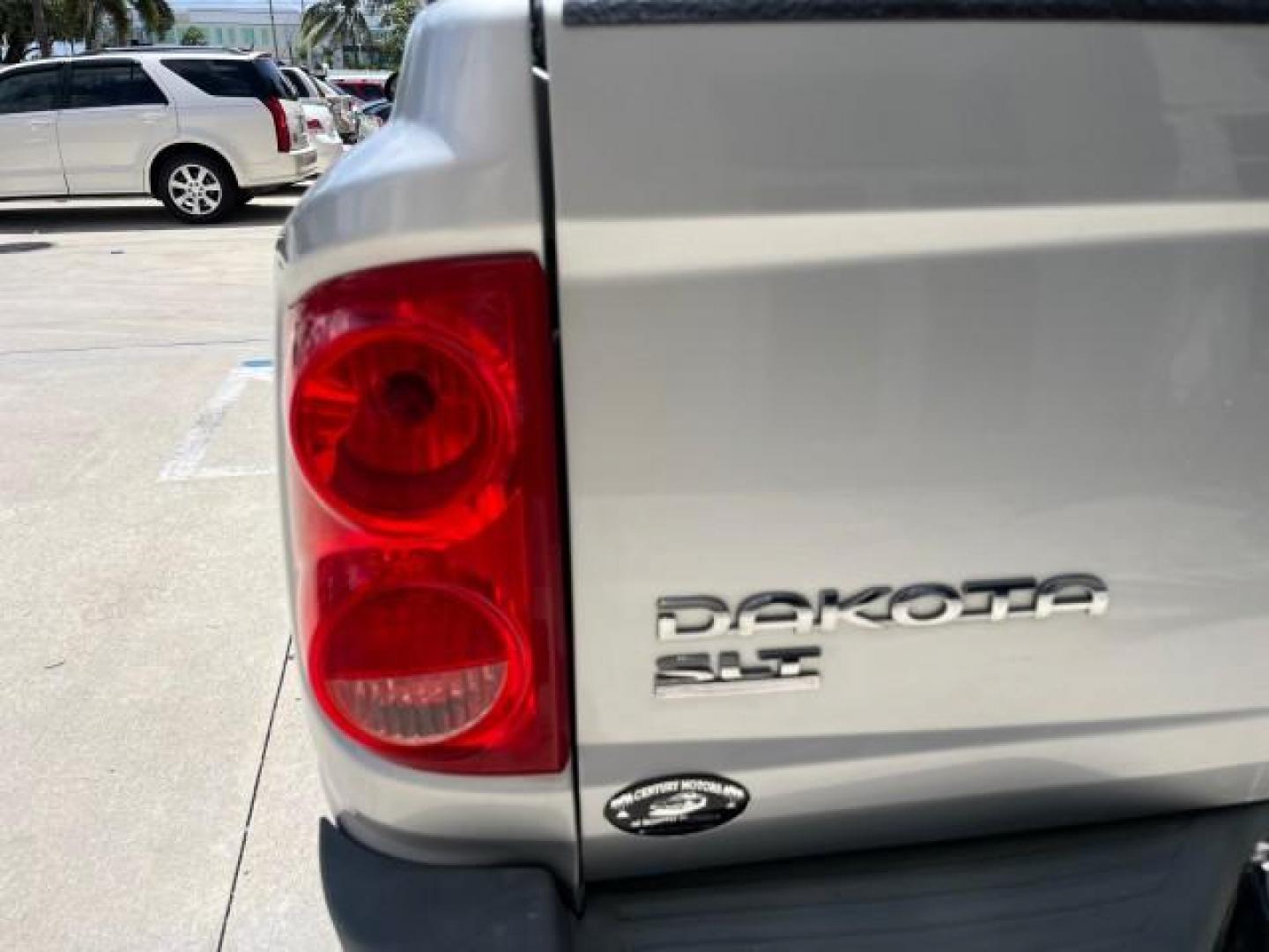 2005 Bright Silver Metallic /Med Slate Gray Dodge Dakota X CAB SLT LOW MILES 65,989 (1D7HE42KX5S) with an 3.7L V6 Magnum Engine engine, Automatic transmission, located at 4701 North Dixie Hwy, Pompano Beach, FL, 33064, (954) 422-2889, 26.240938, -80.123474 - OUR WEBPAGE FLORIDACARS1.COM HAS OVER 90 PHOTOS AND FREE CARFAX LINK 2005 DODGE DAKOTA SLT ROAD READY WORK READY VIN: 1D7HE42KX5S129990 FLORIDA OWNER 3.7L V6 CLUB CAB PICKUP LOW MILES 65,989 3.7L V6 F 6.6FT BED LENGHT GASOLINE POWER SEATS REAR WHEEL DRIVE POWER MIRRORS 6.6' Bed Length Alloy Wheels A - Photo#79