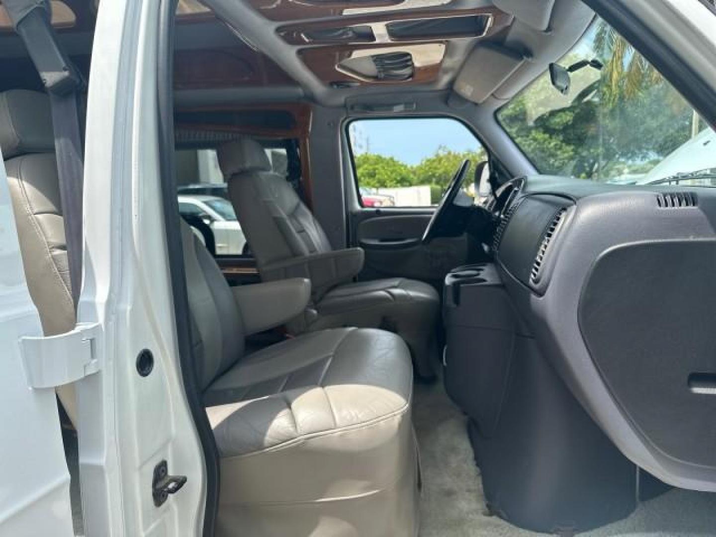 2000 Bright White /Mist Gray Dodge Ram Van HI TOP Conversion (2B6HB11YXYK) with an 5.2L MPI V8 Magnum Engine engine, Automatic transmission, located at 4701 North Dixie Hwy, Pompano Beach, FL, 33064, (954) 422-2889, 26.240938, -80.123474 - OUR WEBPAGE FLORIDACARS1.COM HAS OVER 100 PHOTOS AND FREE CARFAX LINK 2000 DODGE RAM VAN B1500 1 OWNER CALIFORNIA TITLE OWNED SALT FREE HARD TO FIND IN THIS CONDITION CALIFORNIA STAR CUSTOM VAN VIN: 2B6HB11YXYK110186 VAN 5.2L V8 F OHV 16V GASOLINE REAR WHEEL DRIVE Leather Seats Rear Air Conditioning - Photo#12