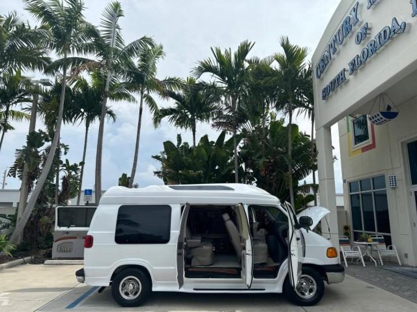 2000 Bright White /Mist Gray Dodge Ram Van HI TOP Conversion (2B6HB11YXYK) with an 5.2L MPI V8 Magnum Engine engine, Automatic transmission, located at 4701 North Dixie Hwy, Pompano Beach, FL, 33064, (954) 422-2889, 26.240938, -80.123474 - OUR WEBPAGE FLORIDACARS1.COM HAS OVER 100 PHOTOS AND FREE CARFAX LINK 2000 DODGE RAM VAN B1500 1 OWNER CALIFORNIA TITLE OWNED SALT FREE HARD TO FIND IN THIS CONDITION CALIFORNIA STAR CUSTOM VAN VIN: 2B6HB11YXYK110186 VAN 5.2L V8 F OHV 16V GASOLINE REAR WHEEL DRIVE Leather Seats Rear Air Conditioning - Photo#56