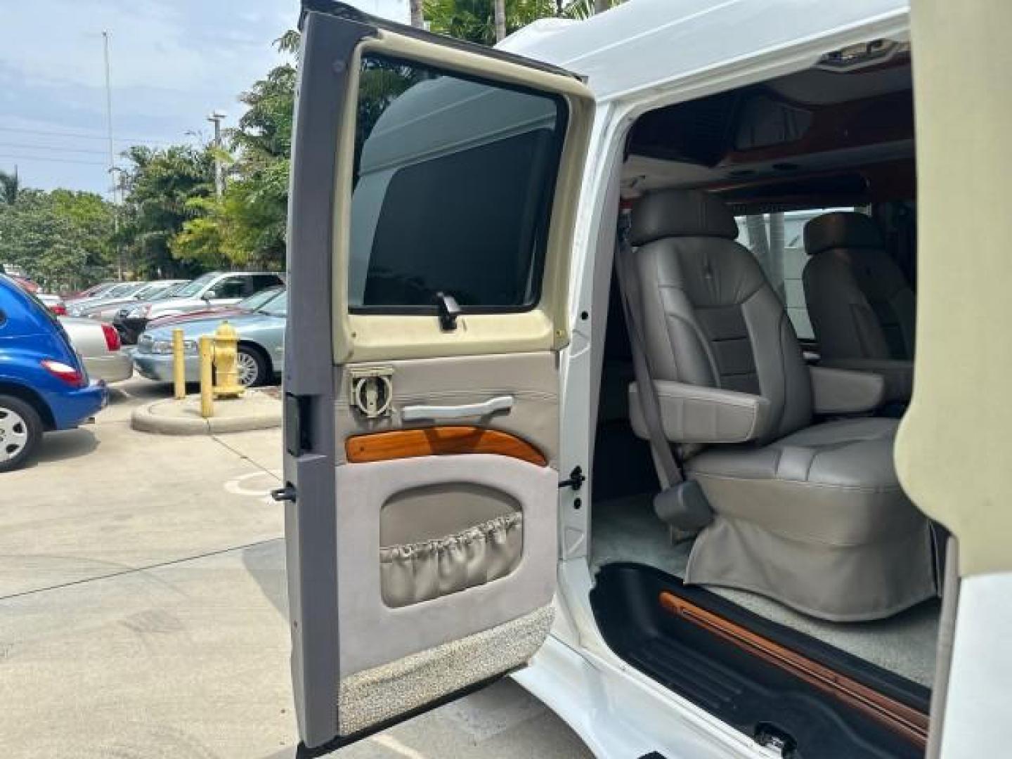 2000 Bright White /Mist Gray Dodge Ram Van HI TOP Conversion (2B6HB11YXYK) with an 5.2L MPI V8 Magnum Engine engine, Automatic transmission, located at 4701 North Dixie Hwy, Pompano Beach, FL, 33064, (954) 422-2889, 26.240938, -80.123474 - OUR WEBPAGE FLORIDACARS1.COM HAS OVER 100 PHOTOS AND FREE CARFAX LINK 2000 DODGE RAM VAN B1500 1 OWNER CALIFORNIA TITLE OWNED SALT FREE HARD TO FIND IN THIS CONDITION CALIFORNIA STAR CUSTOM VAN VIN: 2B6HB11YXYK110186 VAN 5.2L V8 F OHV 16V GASOLINE REAR WHEEL DRIVE Leather Seats Rear Air Conditioning - Photo#61