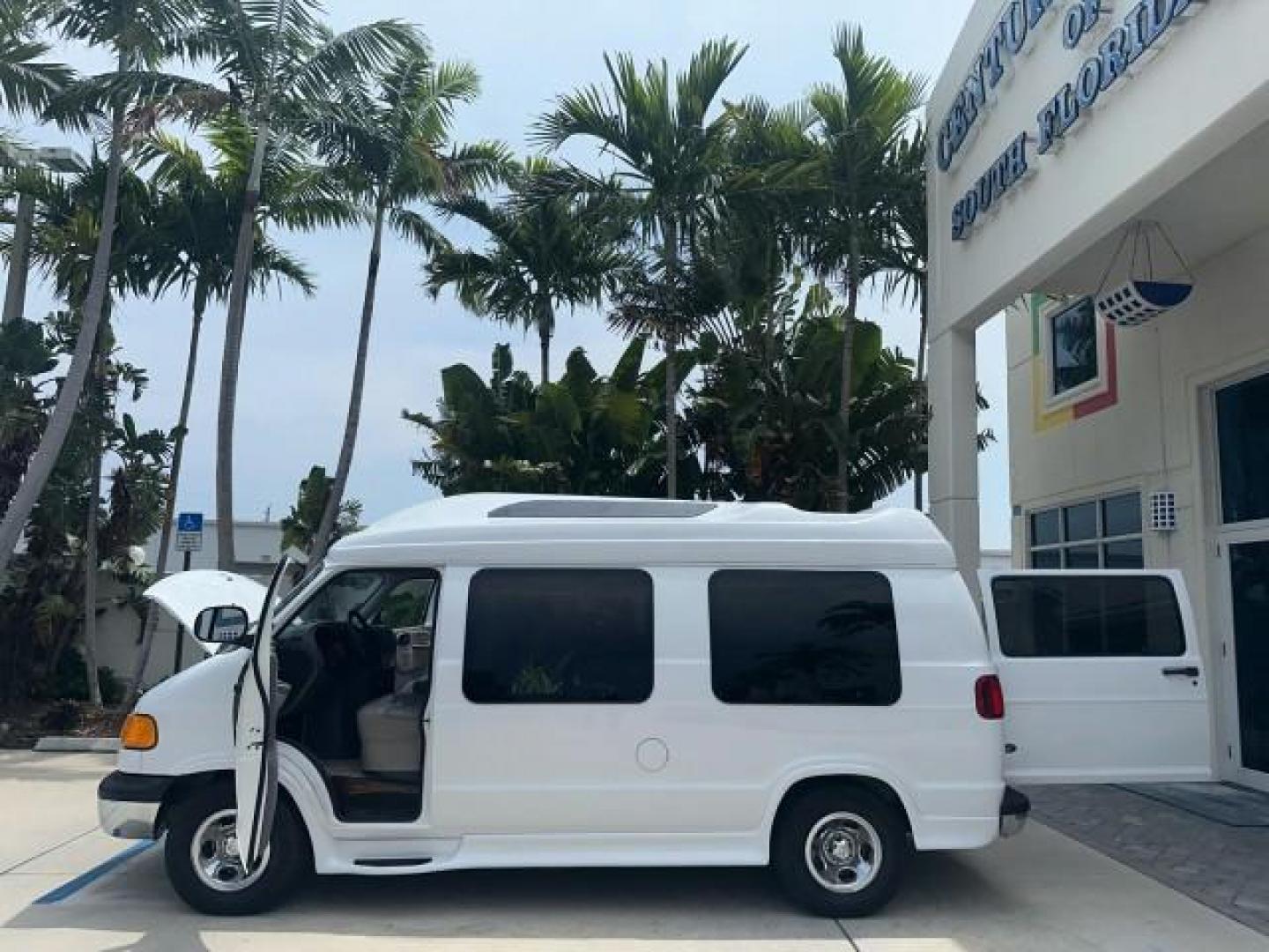 2000 Bright White /Mist Gray Dodge Ram Van HI TOP Conversion (2B6HB11YXYK) with an 5.2L MPI V8 Magnum Engine engine, Automatic transmission, located at 4701 North Dixie Hwy, Pompano Beach, FL, 33064, (954) 422-2889, 26.240938, -80.123474 - OUR WEBPAGE FLORIDACARS1.COM HAS OVER 100 PHOTOS AND FREE CARFAX LINK 2000 DODGE RAM VAN B1500 1 OWNER CALIFORNIA TITLE OWNED SALT FREE HARD TO FIND IN THIS CONDITION CALIFORNIA STAR CUSTOM VAN VIN: 2B6HB11YXYK110186 VAN 5.2L V8 F OHV 16V GASOLINE REAR WHEEL DRIVE Leather Seats Rear Air Conditioning - Photo#7