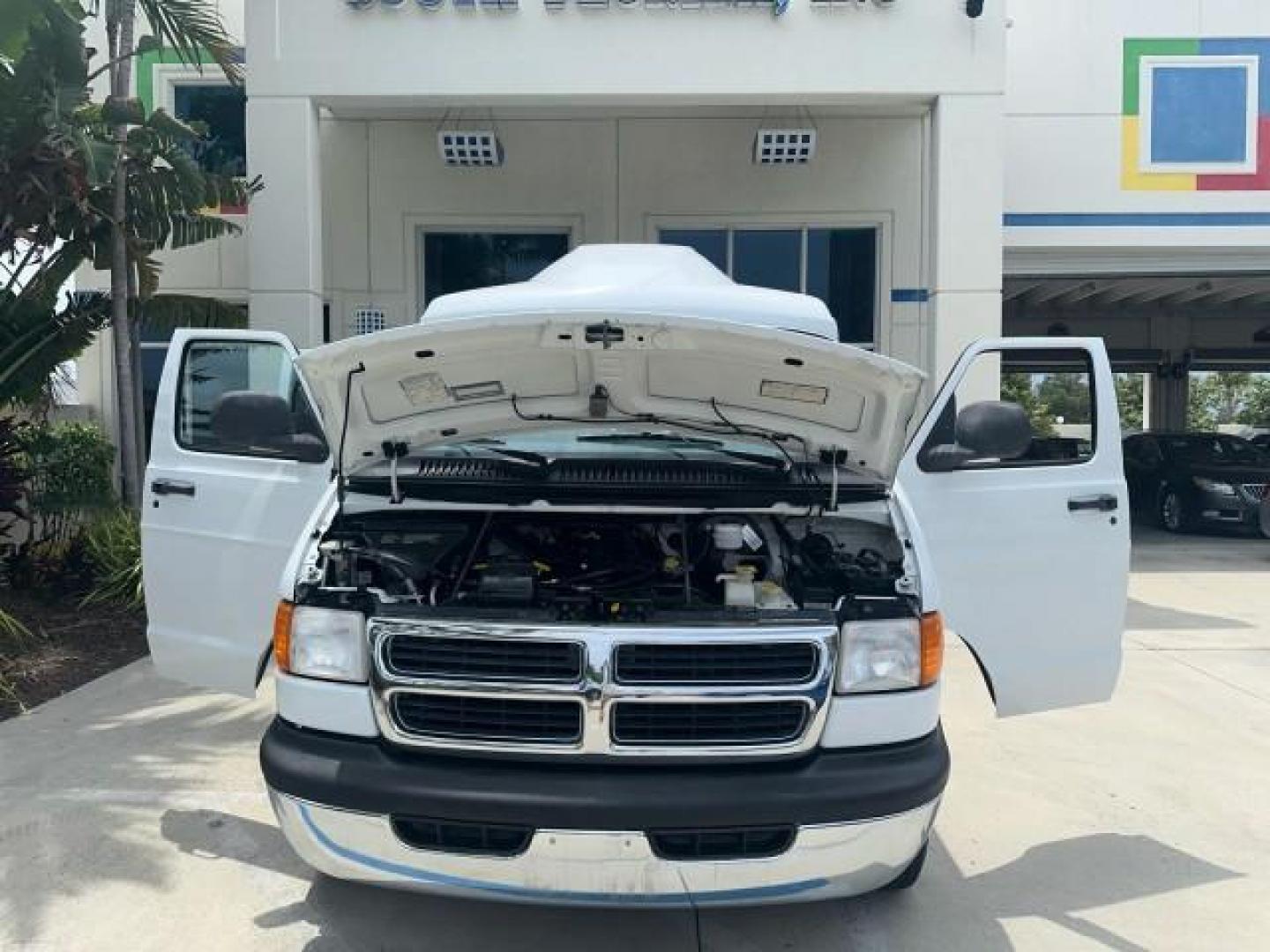 2000 Bright White /Mist Gray Dodge Ram Van HI TOP Conversion (2B6HB11YXYK) with an 5.2L MPI V8 Magnum Engine engine, Automatic transmission, located at 4701 North Dixie Hwy, Pompano Beach, FL, 33064, (954) 422-2889, 26.240938, -80.123474 - OUR WEBPAGE FLORIDACARS1.COM HAS OVER 100 PHOTOS AND FREE CARFAX LINK 2000 DODGE RAM VAN B1500 1 OWNER CALIFORNIA TITLE OWNED SALT FREE HARD TO FIND IN THIS CONDITION CALIFORNIA STAR CUSTOM VAN VIN: 2B6HB11YXYK110186 VAN 5.2L V8 F OHV 16V GASOLINE REAR WHEEL DRIVE Leather Seats Rear Air Conditioning - Photo#8