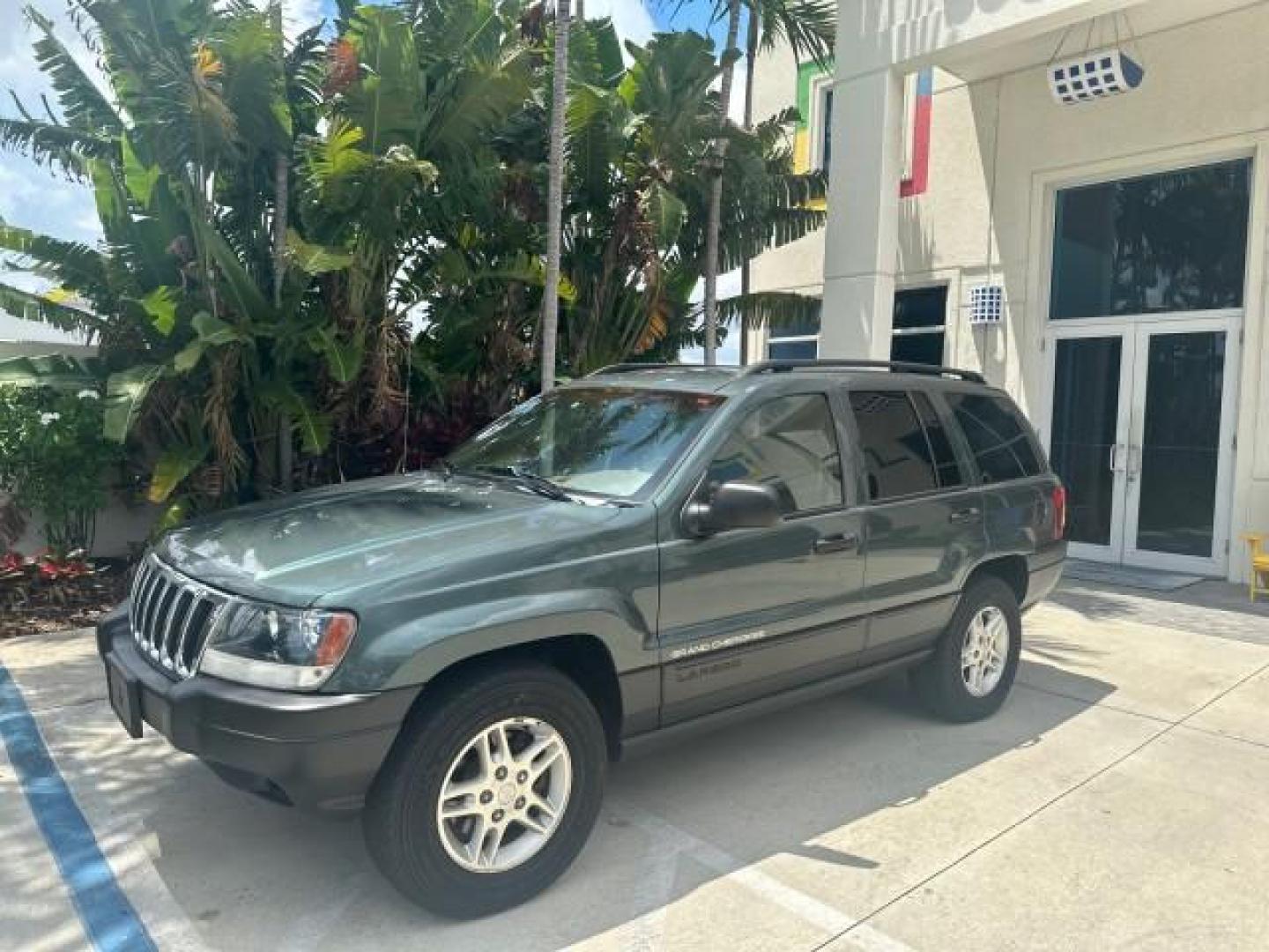 2002 Onyx Green Pearl /Sandstone Jeep Grand Cherokee 4w4 Laredo LOW MILES 87,762 (1J4GW48S42C) with an 4.0L SMFI I6 Power Tech Engine engine, Automatic transmission, located at 4701 North Dixie Hwy, Pompano Beach, FL, 33064, (954) 422-2889, 26.240938, -80.123474 - OUR WEBPAGE FLORIDACARS1.COM HAS OVER 100 PHOTOS AND FREE CARFAX LINK 2002 JEEP GRAND CHEROKEE LAREDO ROAD READY 4.0L V6 VIN: 1J4GW48S42C308150 NO ACCIDENTS 4 DOOR WAGON/SPORT UTILITY NO RECALLS 4X4 4.0L I6 F TOW PKG LOW MILES 87,762 GASOLINE POWER SEATS/MIRRORS REAR WHEEL DRIVE W/ 4X4 30 SERVICE RE - Photo#1