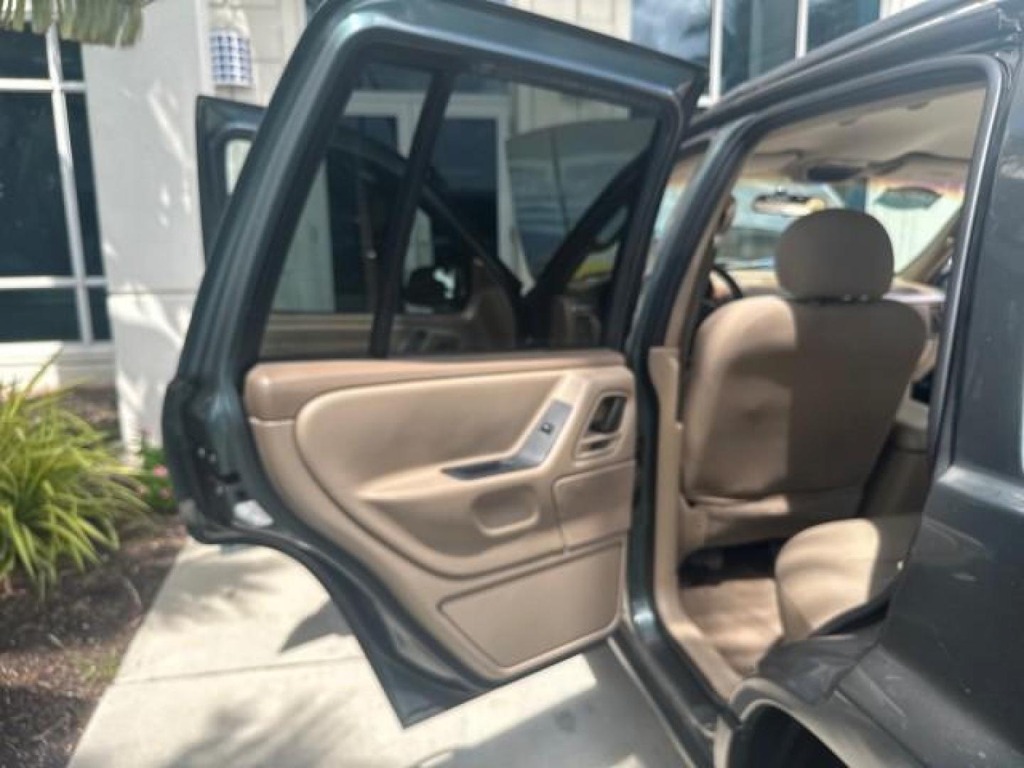 2002 Onyx Green Pearl /Sandstone Jeep Grand Cherokee 4w4 Laredo LOW MILES 87,762 (1J4GW48S42C) with an 4.0L SMFI I6 Power Tech Engine engine, Automatic transmission, located at 4701 North Dixie Hwy, Pompano Beach, FL, 33064, (954) 422-2889, 26.240938, -80.123474 - OUR WEBPAGE FLORIDACARS1.COM HAS OVER 100 PHOTOS AND FREE CARFAX LINK 2002 JEEP GRAND CHEROKEE LAREDO ROAD READY 4.0L V6 VIN: 1J4GW48S42C308150 NO ACCIDENTS 4 DOOR WAGON/SPORT UTILITY NO RECALLS 4X4 4.0L I6 F TOW PKG LOW MILES 87,762 GASOLINE POWER SEATS/MIRRORS REAR WHEEL DRIVE W/ 4X4 30 SERVICE RE - Photo#66