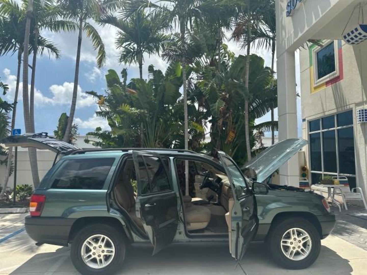 2002 Onyx Green Pearl /Sandstone Jeep Grand Cherokee 4w4 Laredo LOW MILES 87,762 (1J4GW48S42C) with an 4.0L SMFI I6 Power Tech Engine engine, Automatic transmission, located at 4701 North Dixie Hwy, Pompano Beach, FL, 33064, (954) 422-2889, 26.240938, -80.123474 - OUR WEBPAGE FLORIDACARS1.COM HAS OVER 100 PHOTOS AND FREE CARFAX LINK 2002 JEEP GRAND CHEROKEE LAREDO ROAD READY 4.0L V6 VIN: 1J4GW48S42C308150 NO ACCIDENTS 4 DOOR WAGON/SPORT UTILITY NO RECALLS 4X4 4.0L I6 F TOW PKG LOW MILES 87,762 GASOLINE POWER SEATS/MIRRORS REAR WHEEL DRIVE W/ 4X4 30 SERVICE RE - Photo#6