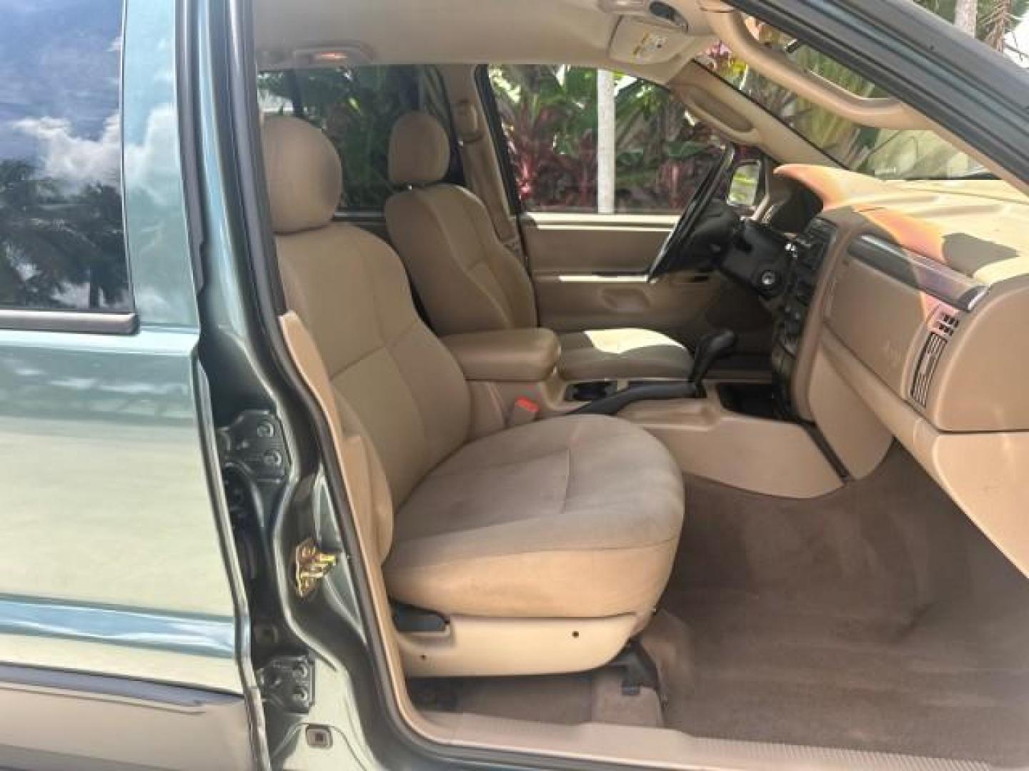 2002 Onyx Green Pearl /Sandstone Jeep Grand Cherokee 4w4 Laredo LOW MILES 87,762 (1J4GW48S42C) with an 4.0L SMFI I6 Power Tech Engine engine, Automatic transmission, located at 4701 North Dixie Hwy, Pompano Beach, FL, 33064, (954) 422-2889, 26.240938, -80.123474 - OUR WEBPAGE FLORIDACARS1.COM HAS OVER 100 PHOTOS AND FREE CARFAX LINK 2002 JEEP GRAND CHEROKEE LAREDO ROAD READY 4.0L V6 VIN: 1J4GW48S42C308150 NO ACCIDENTS 4 DOOR WAGON/SPORT UTILITY NO RECALLS 4X4 4.0L I6 F TOW PKG LOW MILES 87,762 GASOLINE POWER SEATS/MIRRORS REAR WHEEL DRIVE W/ 4X4 30 SERVICE RE - Photo#72