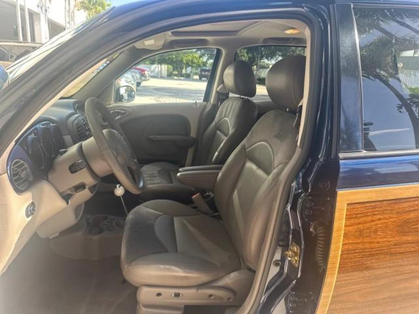 2003 Electric Blue Pearl /Taupe/Pearl Beige Chrysler PT Cruiser Limited WOODY LOW MILES 41,863 (3C8FY68B13T) with an 2.4L DOHC SMPI 16-Valve I4 Engine engine, Automatic transmission, located at 4701 North Dixie Hwy, Pompano Beach, FL, 33064, (954) 422-2889, 26.240938, -80.123474 - OUR WEBPAGE FLORIDACARS1.COM HAS OVER 100 PHOTOS AND FREE CARFAX LINK 2003 CHRYSLER PT CRUISER LIMITED EDITION WOODY EDITION VIN: 3C8FY68B13T591246 3 C 8 F Y 6 8 B 1 3 T 5 9 1 2 4 6 2.4L I4 F DOHC 16V GASOLINE 29 MPG FRONT WHEEL DRIVE NO RECALLS Top Features Alloy Wheels Leather and Suede Seats Su - Photo#78