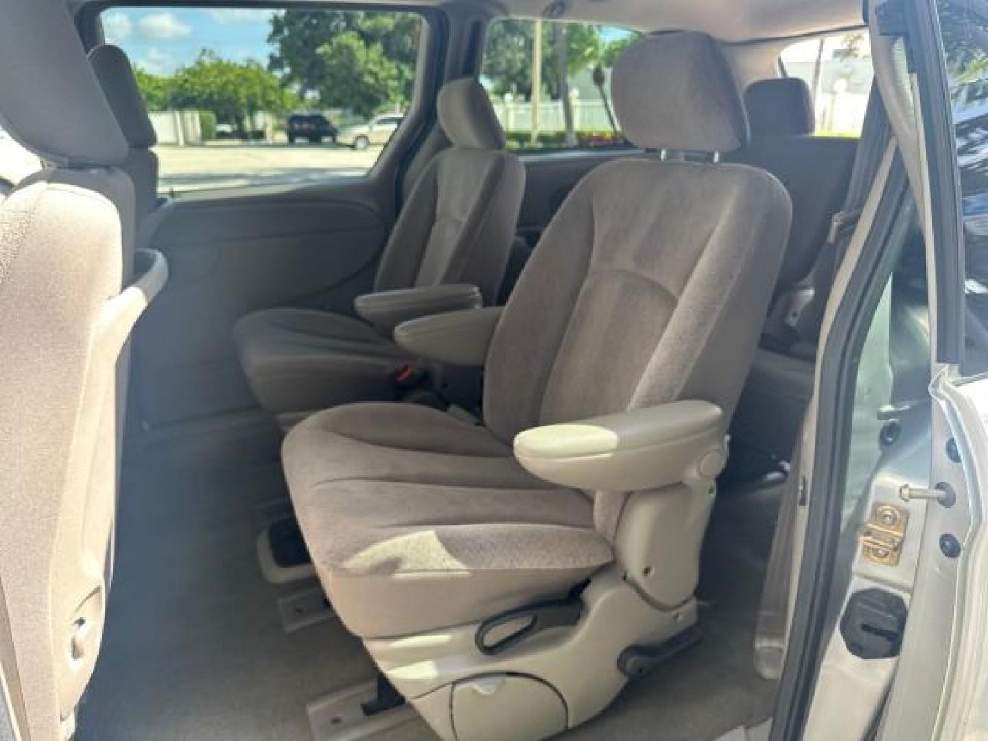 2003 Bright Silver Metallic /Taupe Dodge Caravan EX 1 OWNER FL LOW MILES 58,965 (2D4GP74L93R) with an 3.8L SMPI V6 Engine engine, Automatic transmission, located at 4701 North Dixie Hwy, Pompano Beach, FL, 33064, (954) 422-2889, 26.240938, -80.123474 - OUR WEBPAGE FLORIDACARS1.COM HAS OVER 100 PHOTOS AND FREE CARFAX LINK 2003 DODGE GRAND CARAVAN EX NO RECALLS VIN: 2D4GP74L93R244217 2 D 4 G P 7 4 L 9 3 R 2 4 4 2 1 7 VAN 3.8L V6 F OHV 12V GASOLINE FRONT WHEEL DRIVE NO RECALLS Top Features Alloy Wheels Quad Seats Cloth Seats Rear Air Conditioning Pow - Photo#66