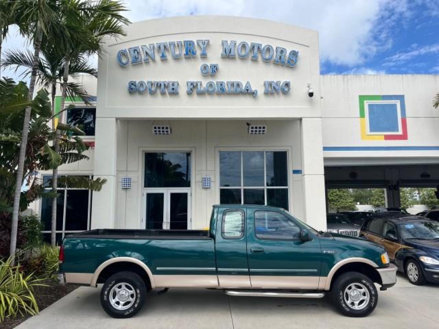 1997 Pacific Green (CC/Met) /Medium Prarie Tan Ford F-150 4WD Lariat LOW MILES 89,299 (1FTDX1860VK) with an 4.6L EFI OHC V8 Triton Engine engine, Automatic transmission, located at 4701 North Dixie Hwy, Pompano Beach, FL, 33064, (954) 422-2889, 26.240938, -80.123474 - OUR WEBPAGE FLORIDACARS1.COM HAS OVER 100 PHOTOS AND FREE CARFAX LINK 1997 FORD F-150 ROAD READY WORK READY VIN: 1FTDX1860VKA73358 NO ACCIDENTS 4X4 3 DOOR EXTENDED CAB PICKUP NO RECALLS 4.6L V8 4.6L V8 F 4X4 FLORIDA OWNER GASOLINE 20 SERVICE RECORDS POWER LEATHER SEATS REAR WHEEL DRIVE W/ 4X4 8 FT B - Photo#0