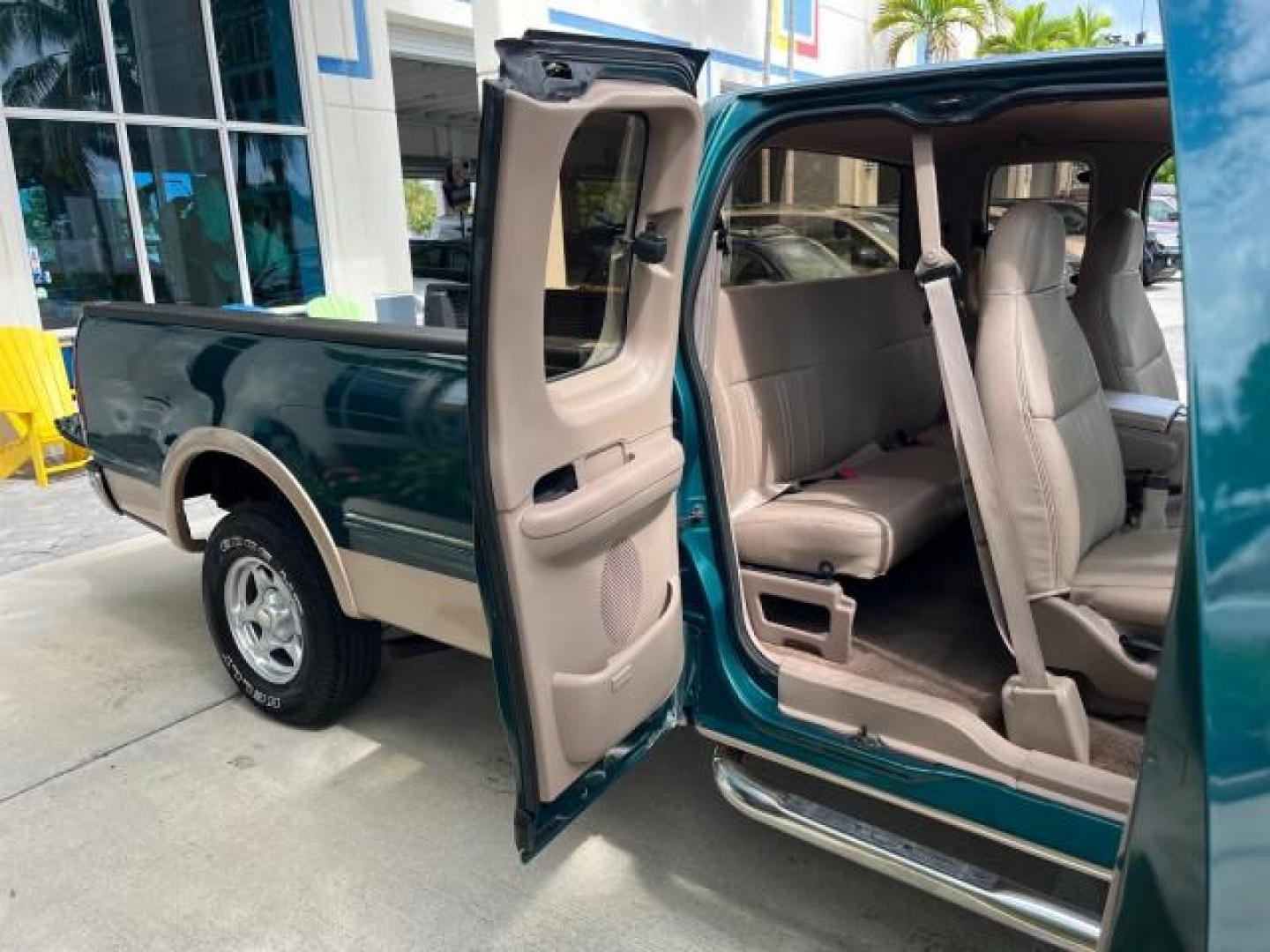 1997 Pacific Green (CC/Met) /Medium Prarie Tan Ford F-150 4WD Lariat LOW MILES 89,299 (1FTDX1860VK) with an 4.6L EFI OHC V8 Triton Engine engine, Automatic transmission, located at 4701 North Dixie Hwy, Pompano Beach, FL, 33064, (954) 422-2889, 26.240938, -80.123474 - OUR WEBPAGE FLORIDACARS1.COM HAS OVER 100 PHOTOS AND FREE CARFAX LINK 1997 FORD F-150 ROAD READY WORK READY VIN: 1FTDX1860VKA73358 NO ACCIDENTS 4X4 3 DOOR EXTENDED CAB PICKUP NO RECALLS 4.6L V8 4.6L V8 F 4X4 FLORIDA OWNER GASOLINE 20 SERVICE RECORDS POWER LEATHER SEATS REAR WHEEL DRIVE W/ 4X4 8 FT B - Photo#13