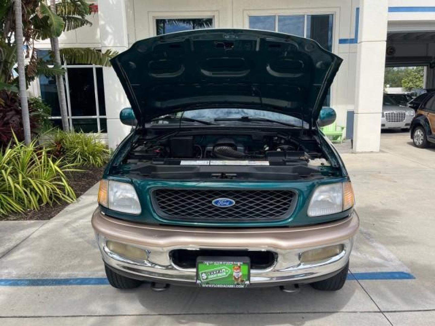 1997 Pacific Green (CC/Met) /Medium Prarie Tan Ford F-150 4WD Lariat LOW MILES 89,299 (1FTDX1860VK) with an 4.6L EFI OHC V8 Triton Engine engine, Automatic transmission, located at 4701 North Dixie Hwy, Pompano Beach, FL, 33064, (954) 422-2889, 26.240938, -80.123474 - OUR WEBPAGE FLORIDACARS1.COM HAS OVER 100 PHOTOS AND FREE CARFAX LINK 1997 FORD F-150 ROAD READY WORK READY VIN: 1FTDX1860VKA73358 NO ACCIDENTS 4X4 3 DOOR EXTENDED CAB PICKUP NO RECALLS 4.6L V8 4.6L V8 F 4X4 FLORIDA OWNER GASOLINE 20 SERVICE RECORDS POWER LEATHER SEATS REAR WHEEL DRIVE W/ 4X4 8 FT B - Photo#63