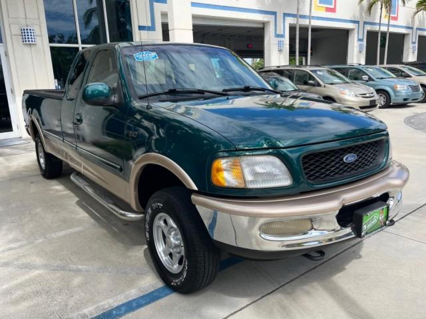 1997 Pacific Green (CC/Met) /Medium Prarie Tan Ford F-150 4WD Lariat LOW MILES 89,299 (1FTDX1860VK) with an 4.6L EFI OHC V8 Triton Engine engine, Automatic transmission, located at 4701 North Dixie Hwy, Pompano Beach, FL, 33064, (954) 422-2889, 26.240938, -80.123474 - OUR WEBPAGE FLORIDACARS1.COM HAS OVER 100 PHOTOS AND FREE CARFAX LINK 1997 FORD F-150 ROAD READY WORK READY VIN: 1FTDX1860VKA73358 NO ACCIDENTS 4X4 3 DOOR EXTENDED CAB PICKUP NO RECALLS 4.6L V8 4.6L V8 F 4X4 FLORIDA OWNER GASOLINE 20 SERVICE RECORDS POWER LEATHER SEATS REAR WHEEL DRIVE W/ 4X4 8 FT B - Photo#69